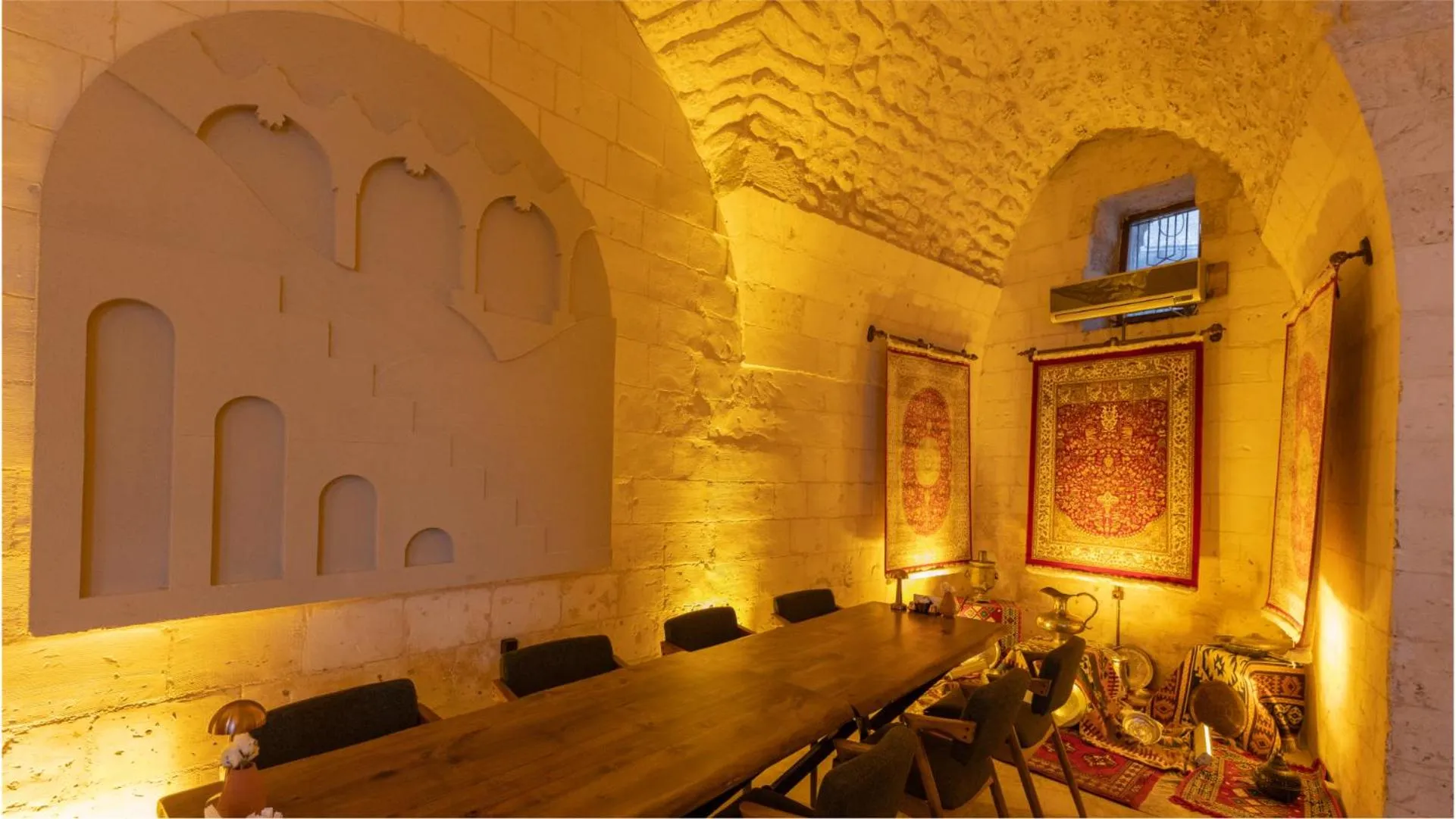 Seating area in Stone House by Cevahir