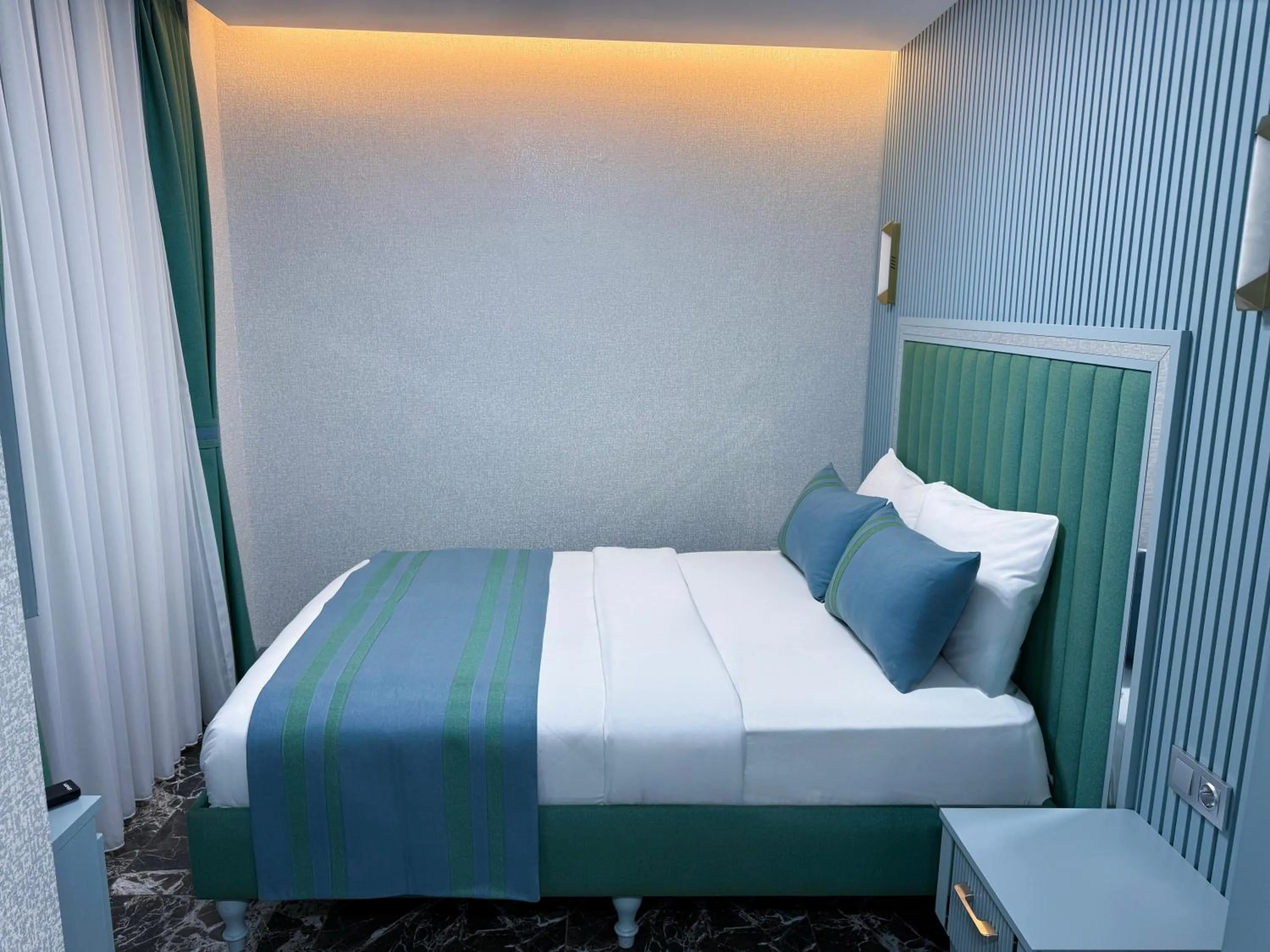 Bed in Santa Rio Gold Taxim Hotel