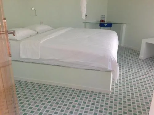 Photo of the whole room, Bed in The Durian Lodge at Mekong