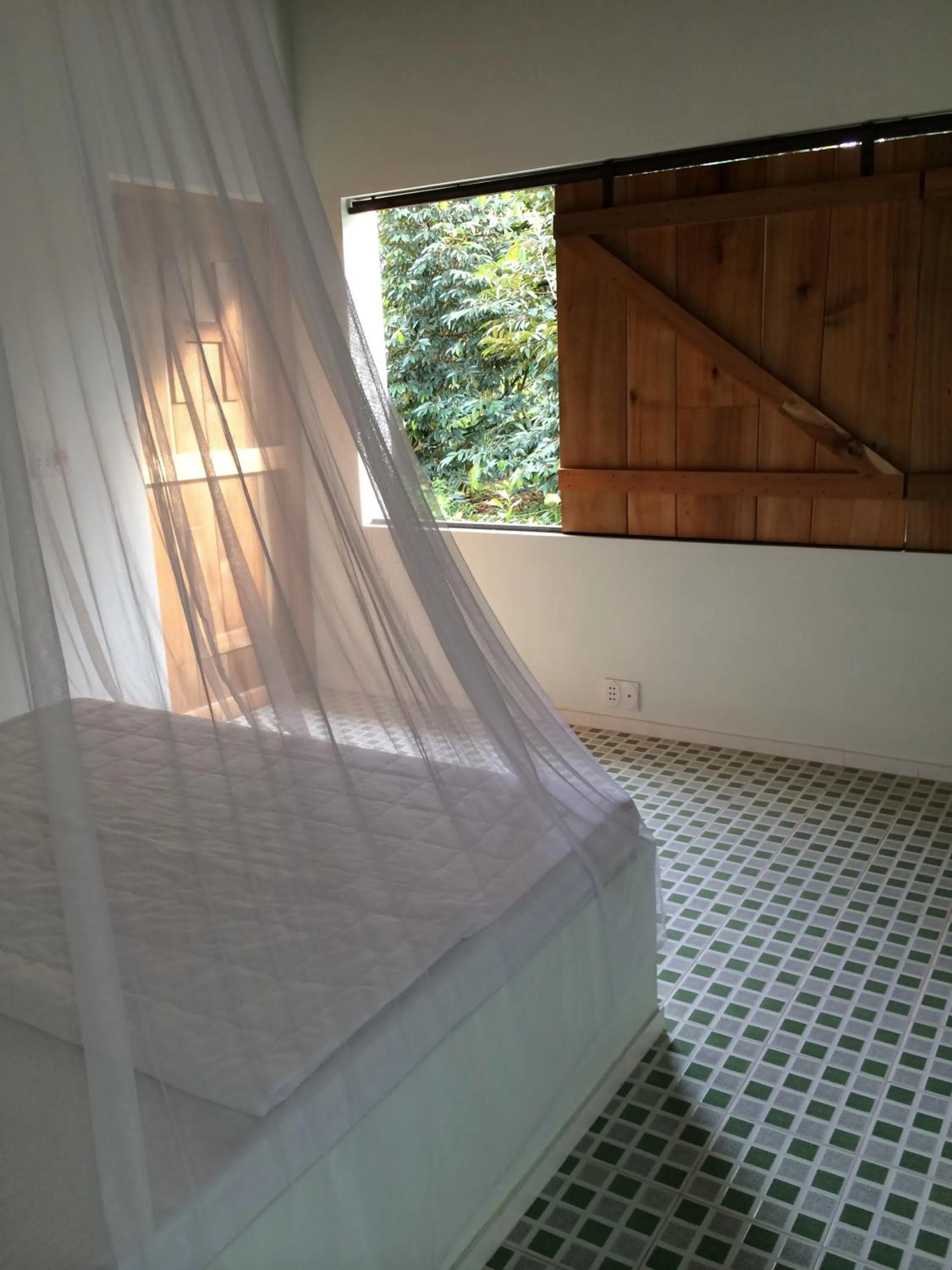 Bed in The Durian Lodge at Mekong