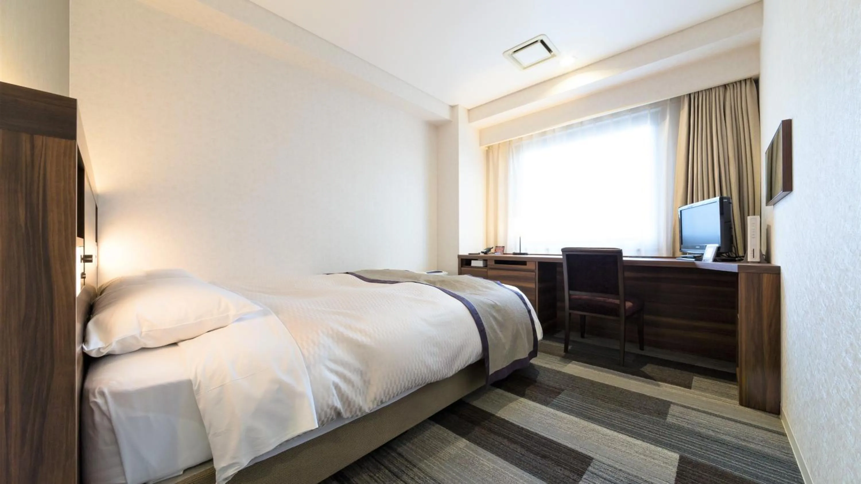 Bed in Kochi Pacific Hotel