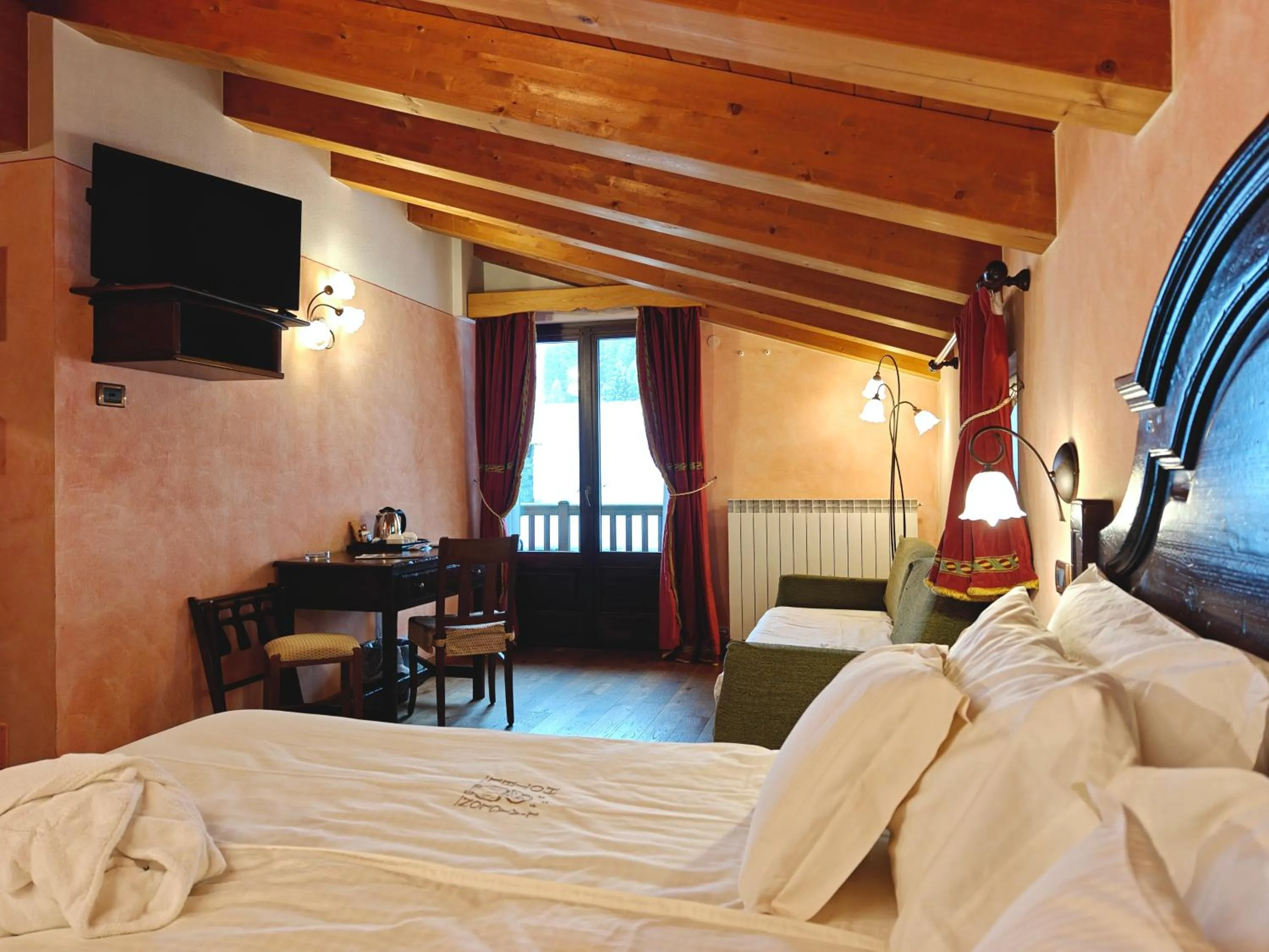 Bed in Hotel L' Aiglon