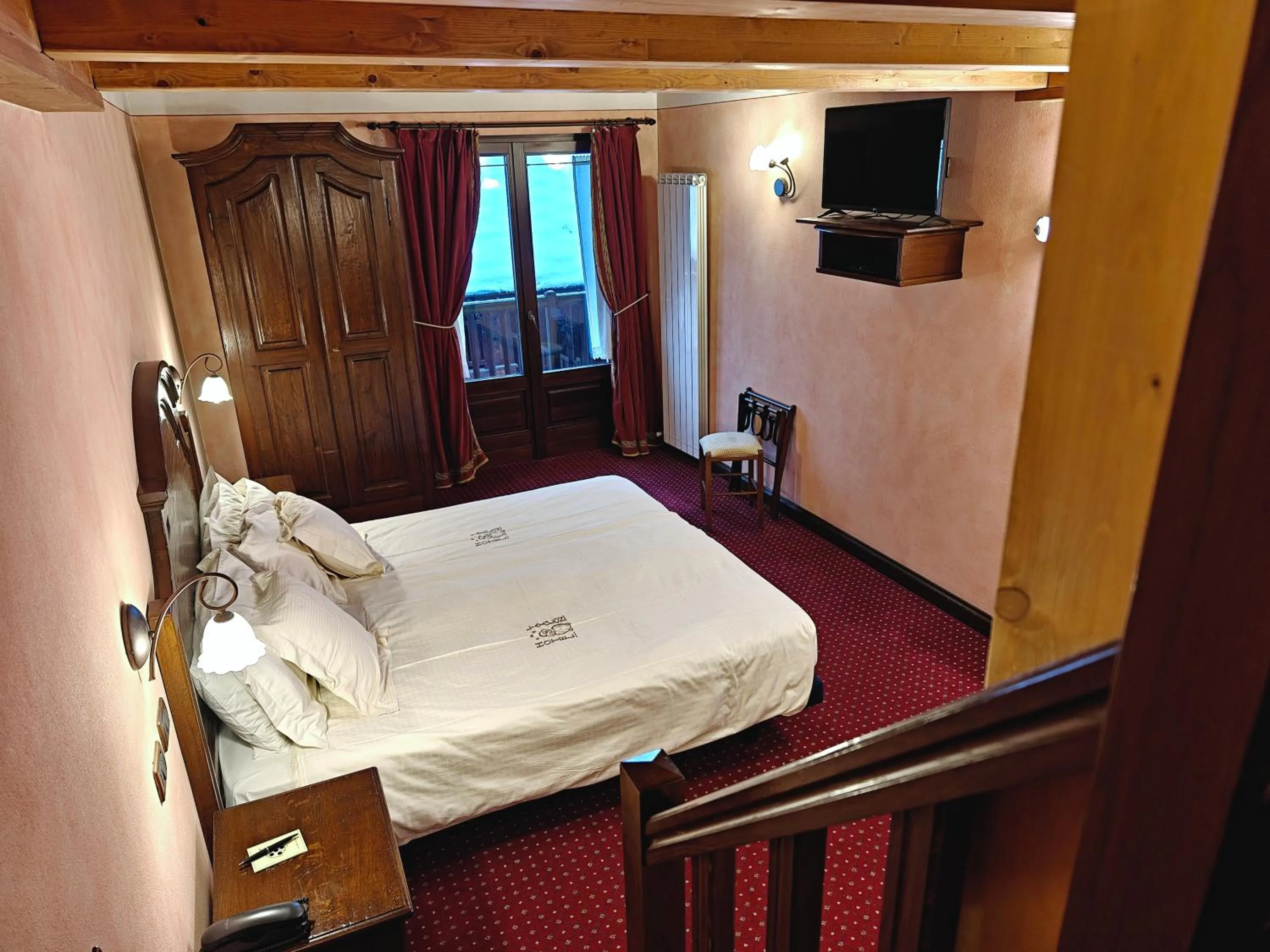 Bed in Hotel L' Aiglon