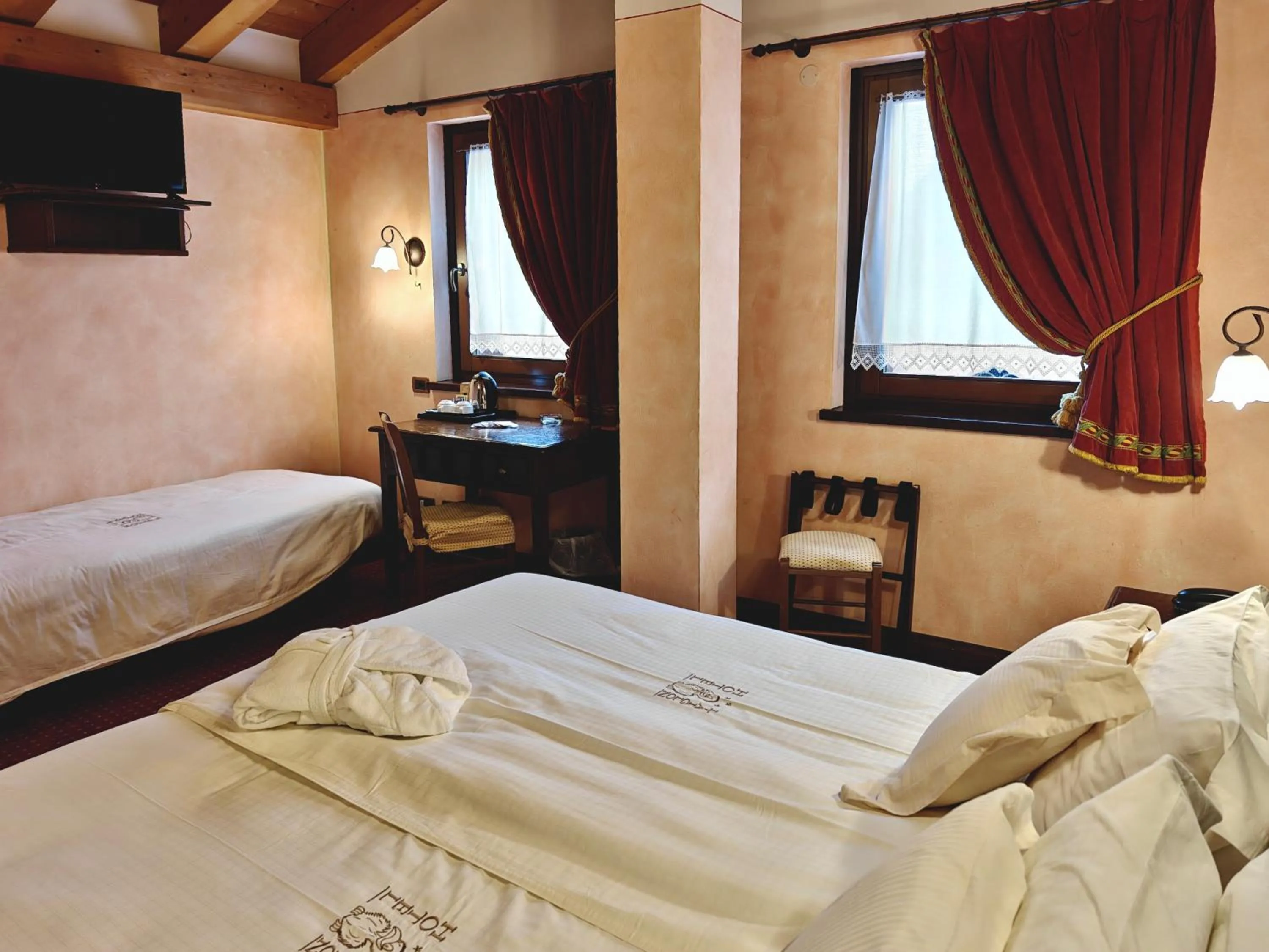 Bed in Hotel L' Aiglon