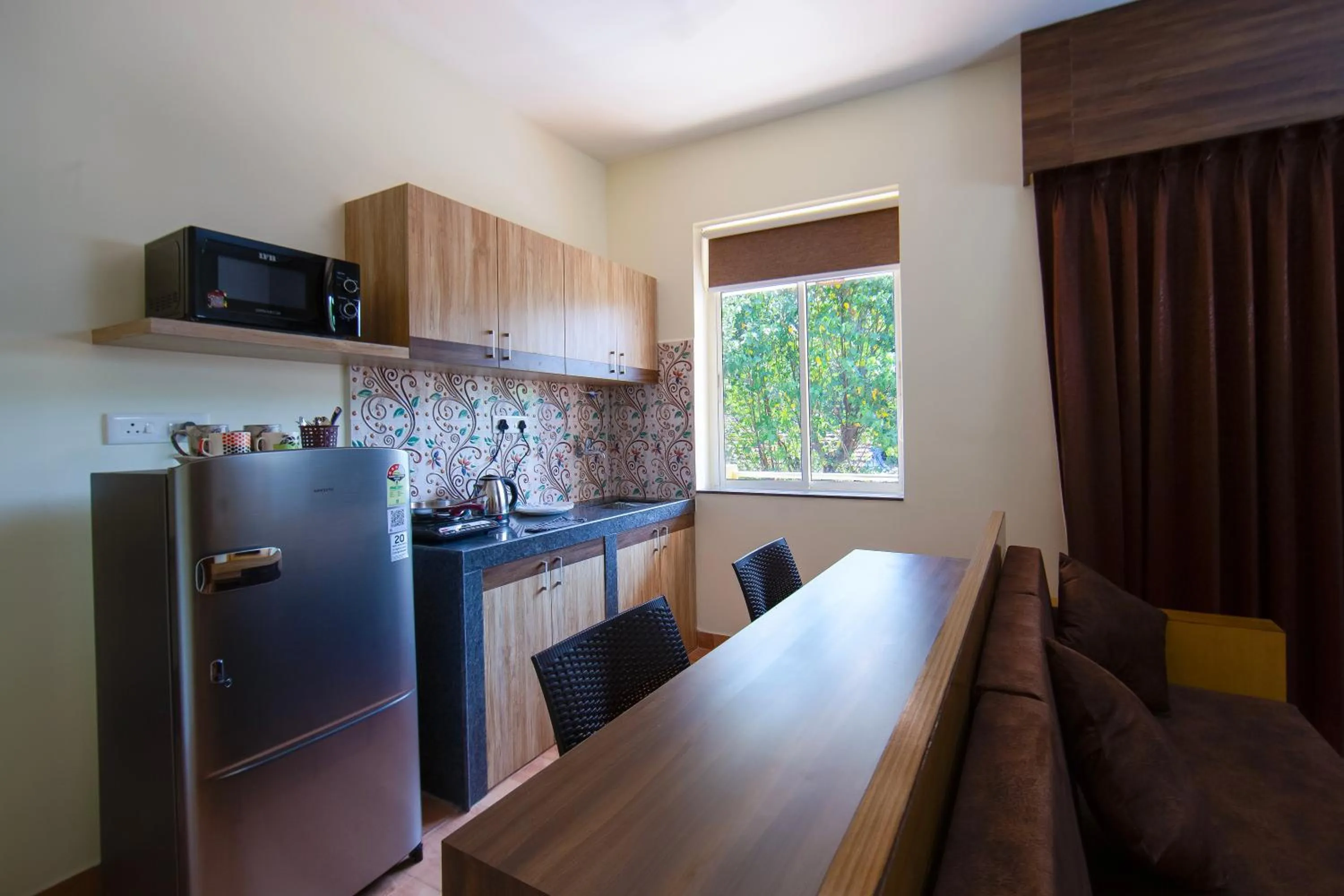 Kitchen or kitchenette in Lykke Suites- 2-min Drive to Colva Beach-By Goan Felicidade Hospitality PVT LTD