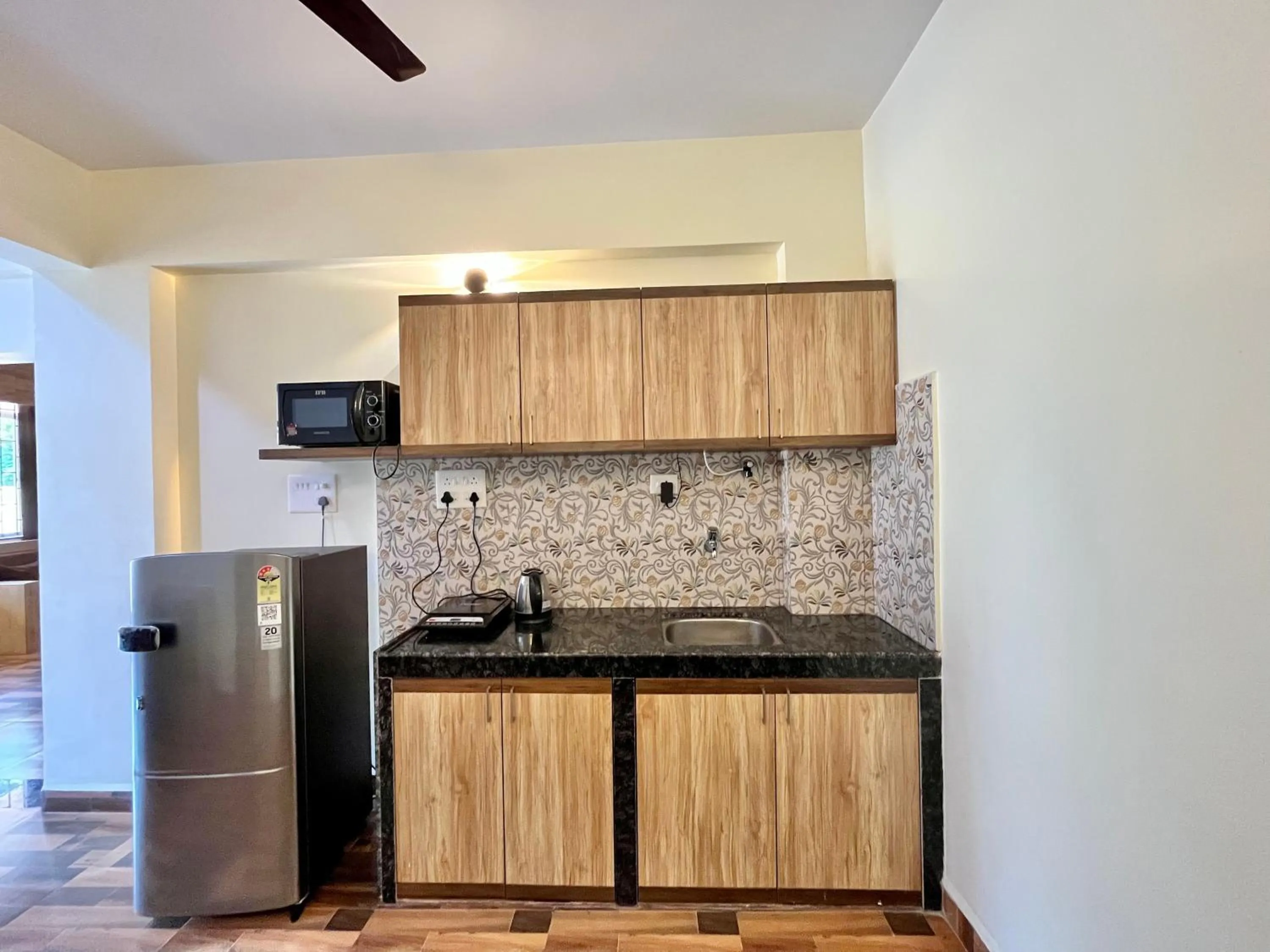 Kitchen or kitchenette in Lykke Suites- 2-min Drive to Colva Beach-By Goan Felicidade Hospitality PVT LTD
