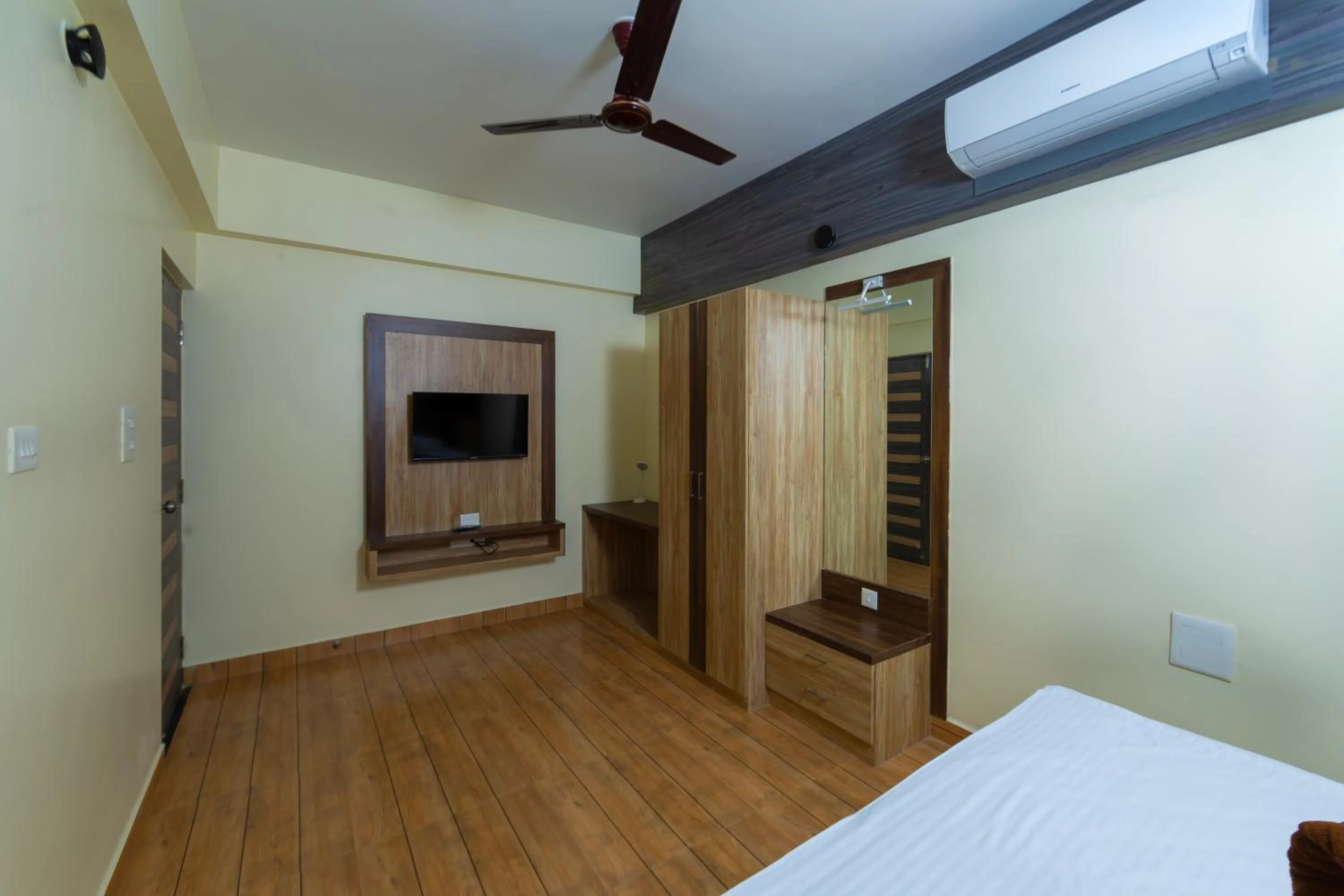 air conditioner, Bed in Lykke Suites- 2-min Drive to Colva Beach-By Goan Felicidade Hospitality PVT LTD