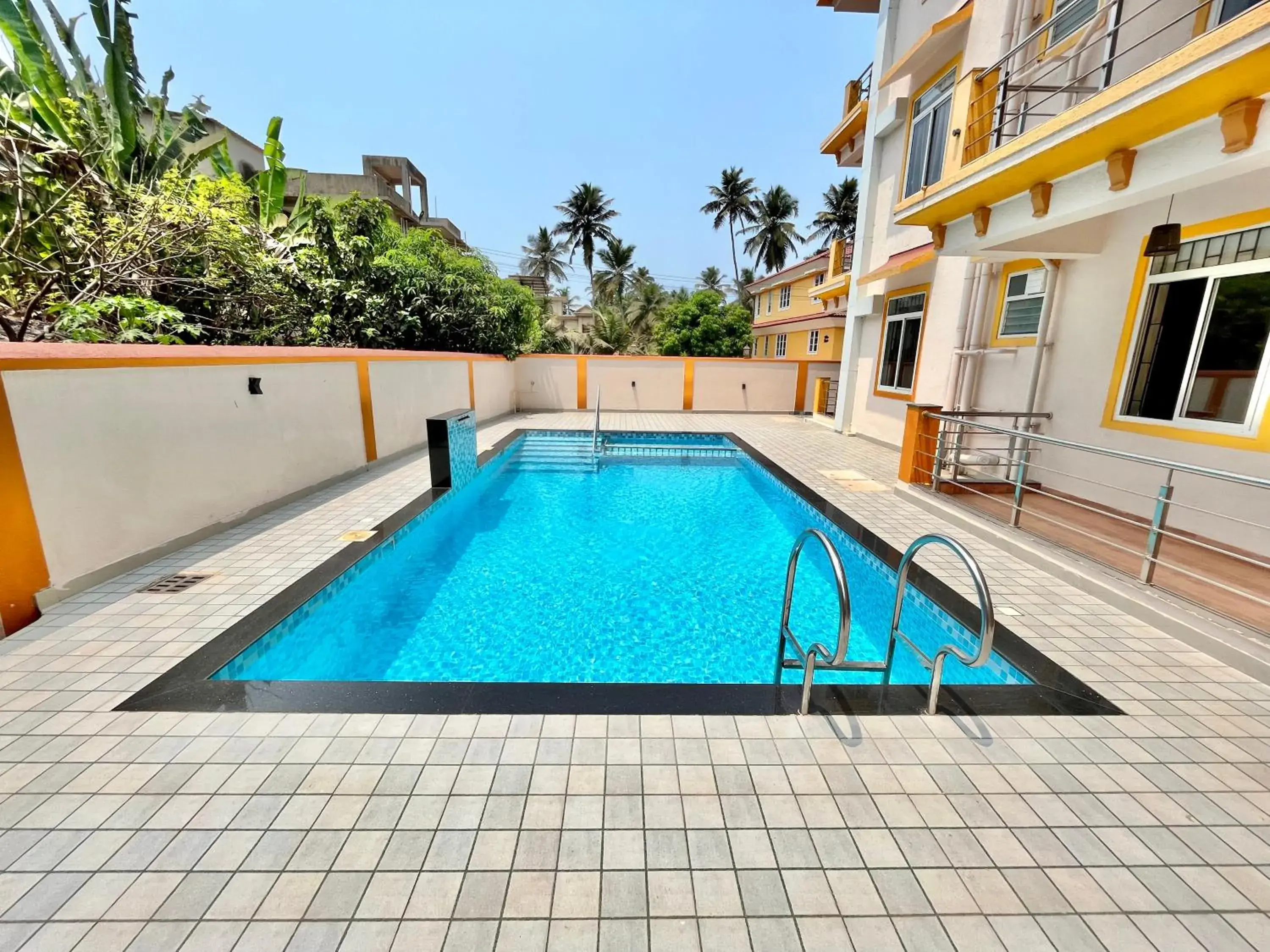 Swimming pool in Lykke Suites- 2-min Drive to Colva Beach-By Goan Felicidade Hospitality PVT LTD Swimming pool in Lykke Suites- 2-min Drive to Colva Beach-By Goan Felicidade Hospitality PVT LTD