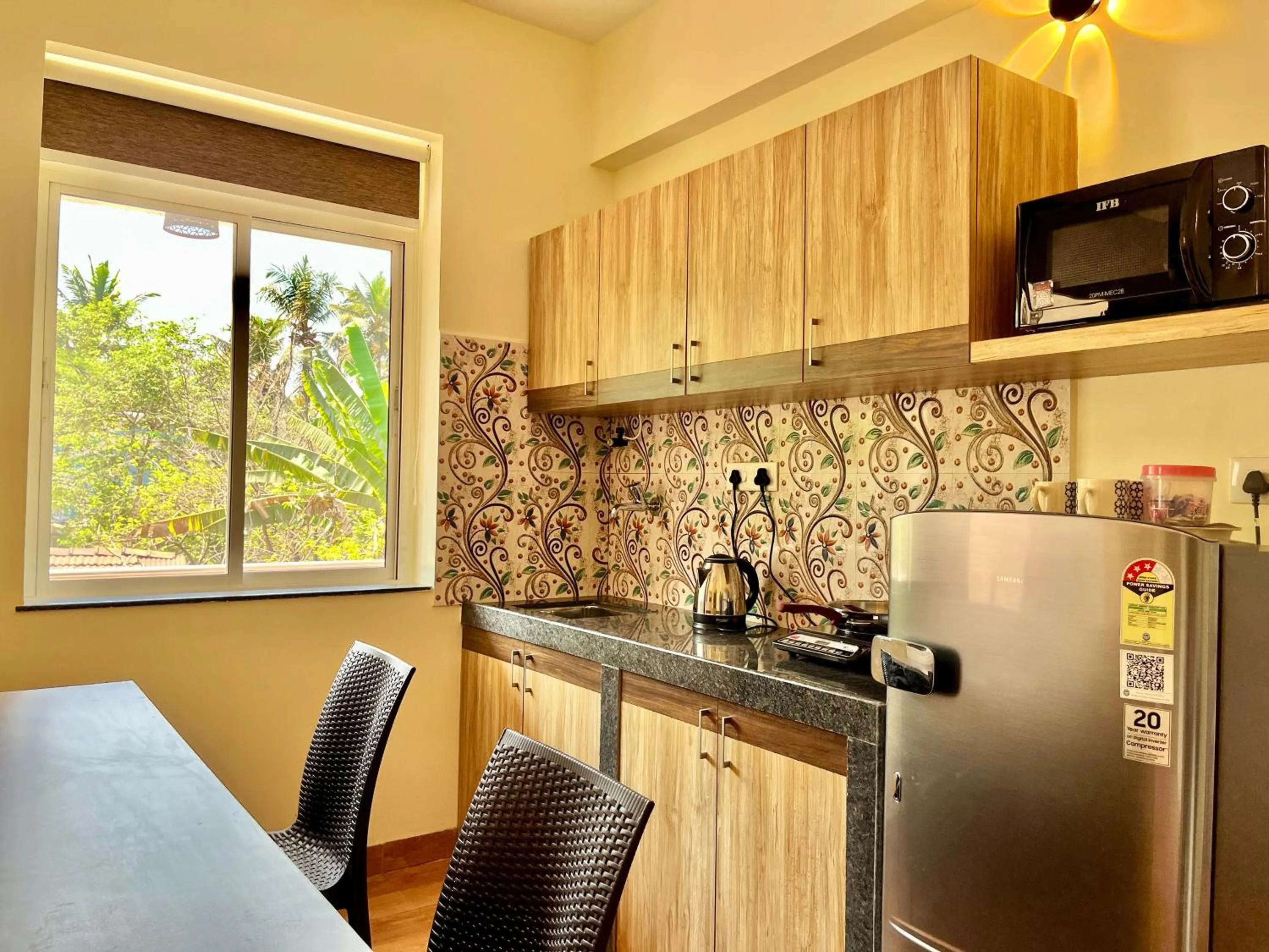 Kitchen or kitchenette in Lykke Suites- 2-min Drive to Colva Beach-By Goan Felicidade Hospitality PVT LTD