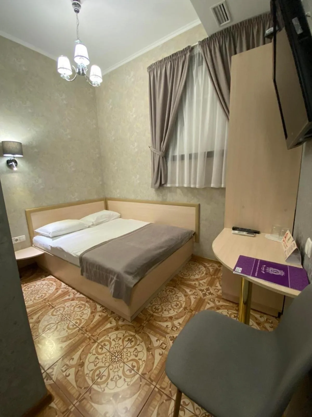 Bed in Grand Christer Hotel