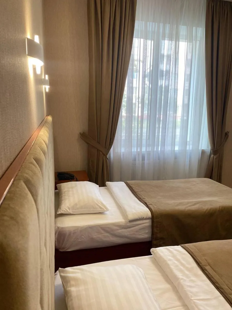 Bed in Grand Christer Hotel