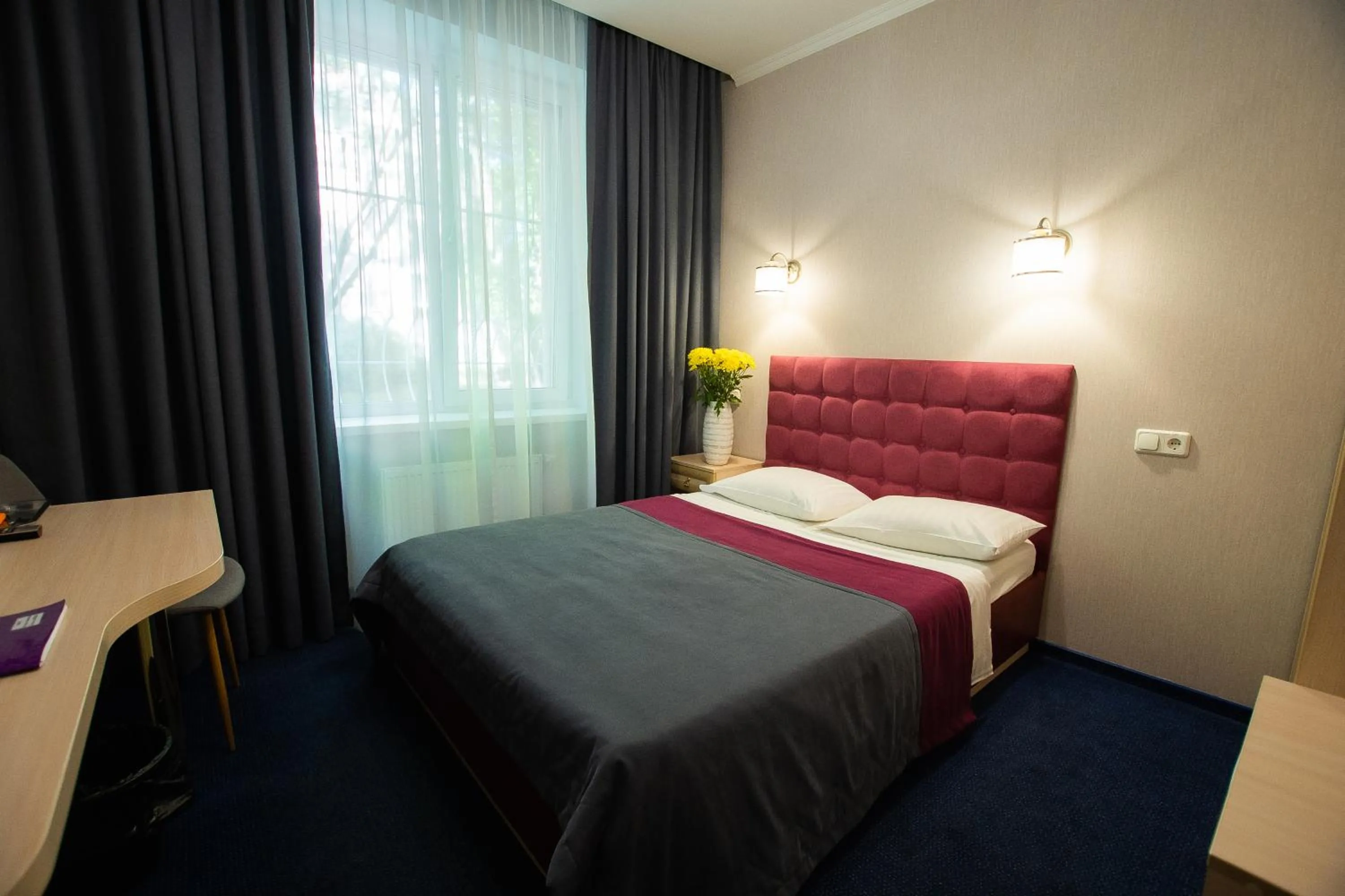 Bed in Grand Christer Hotel