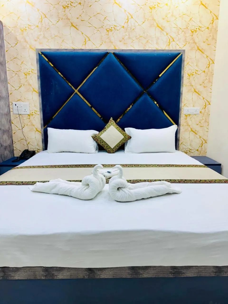 Bed in KashVi Hotels