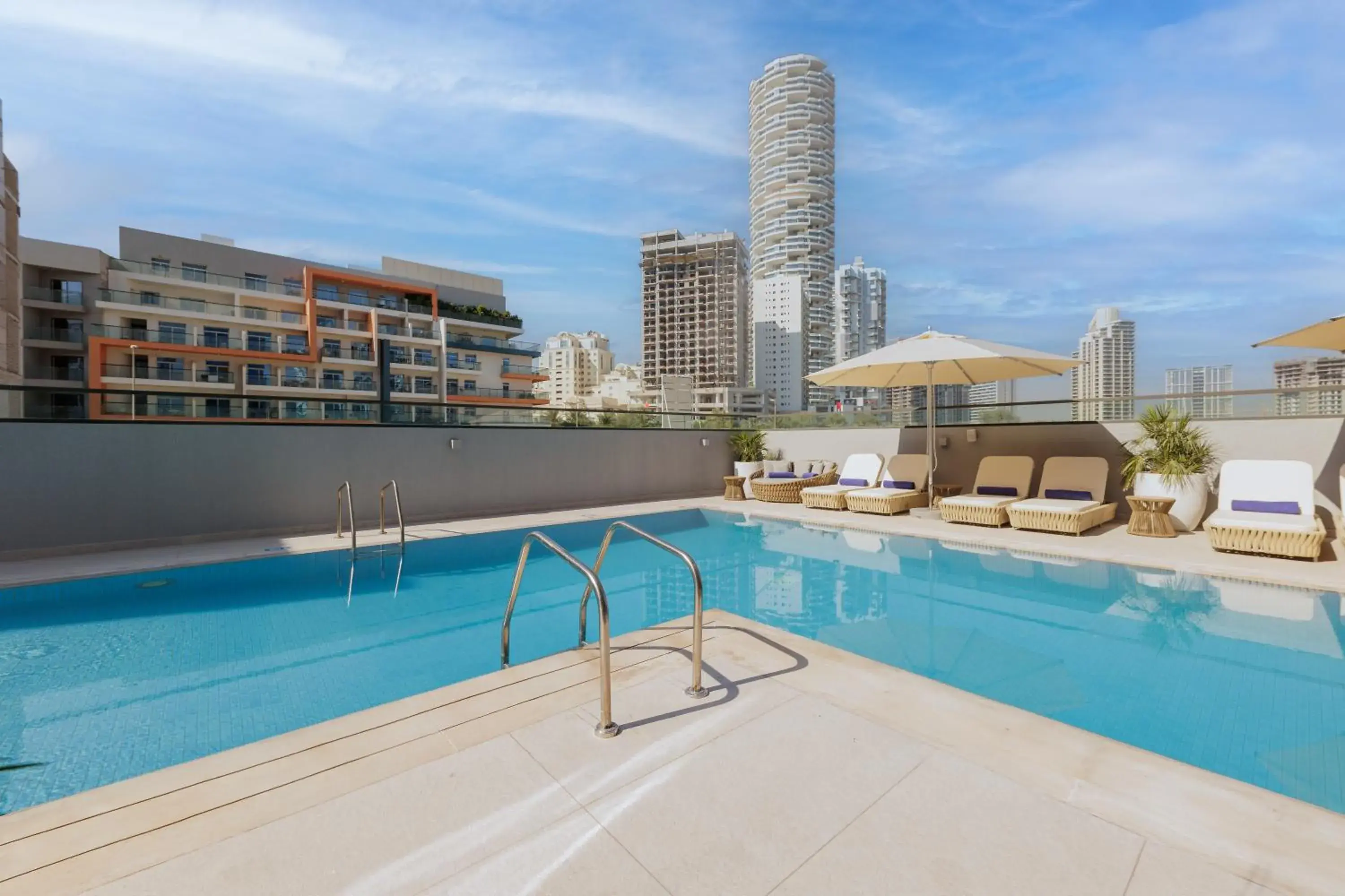 Swimming pool in Holiday Inn Dubai Jumeirah Village Circle by IHG Swimming pool in Holiday Inn Dubai Jumeirah Village Circle by IHG