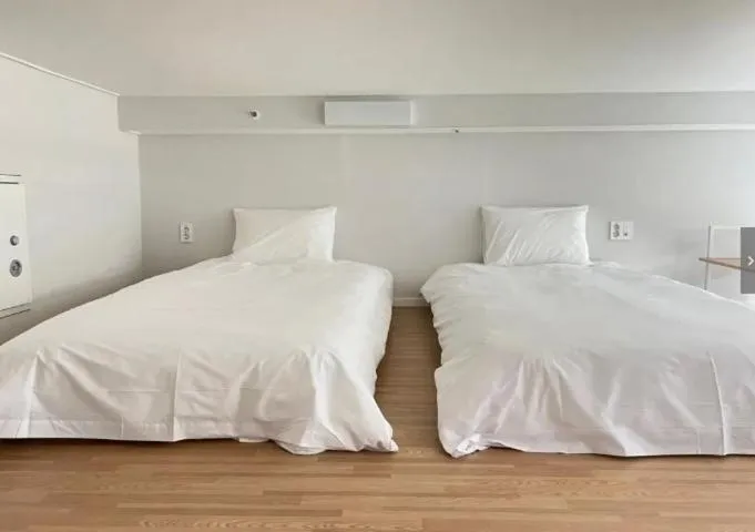 Bed in Blue Ocean Hotel 3