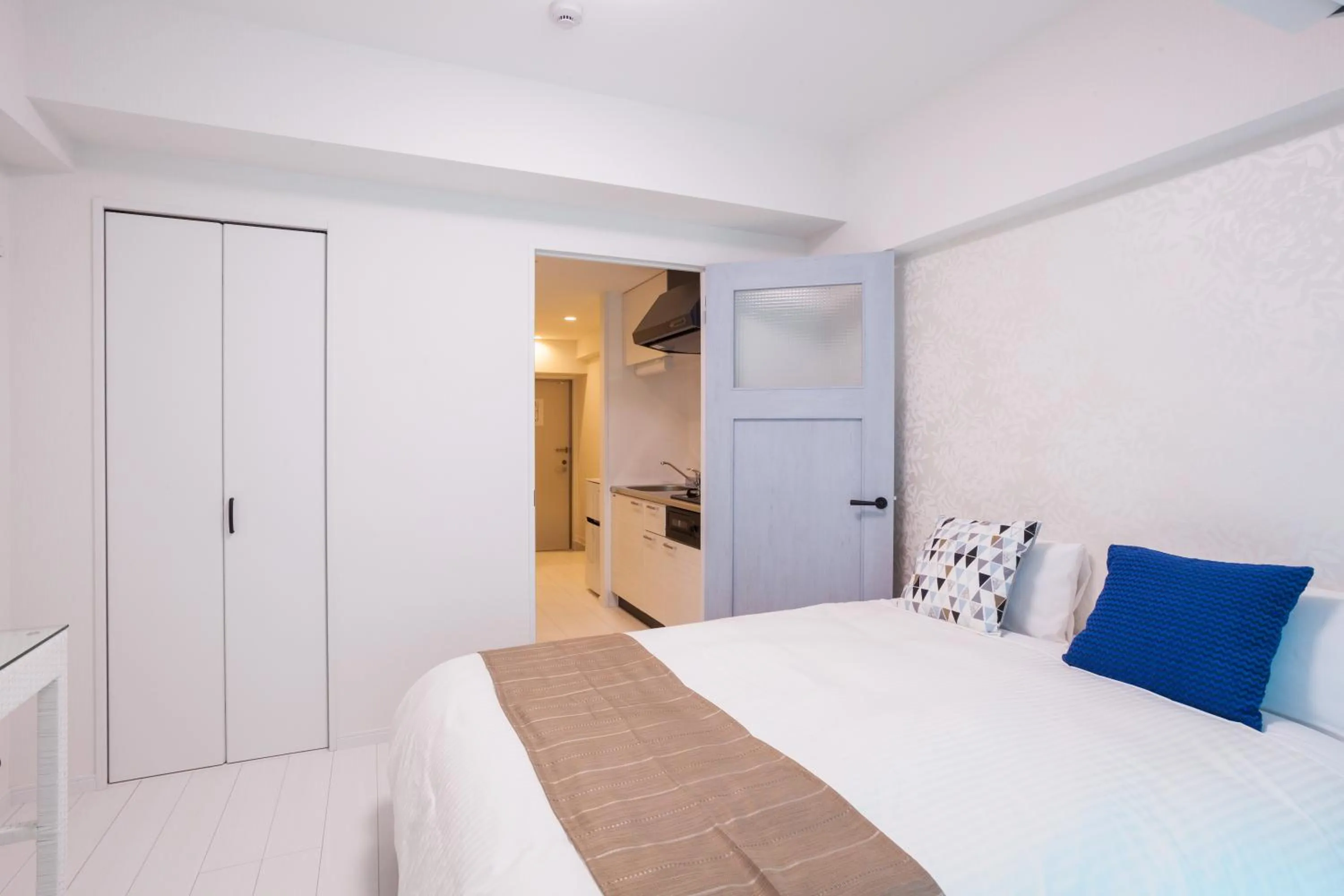 Bed in Living Inn Asahibashiekimae Anex