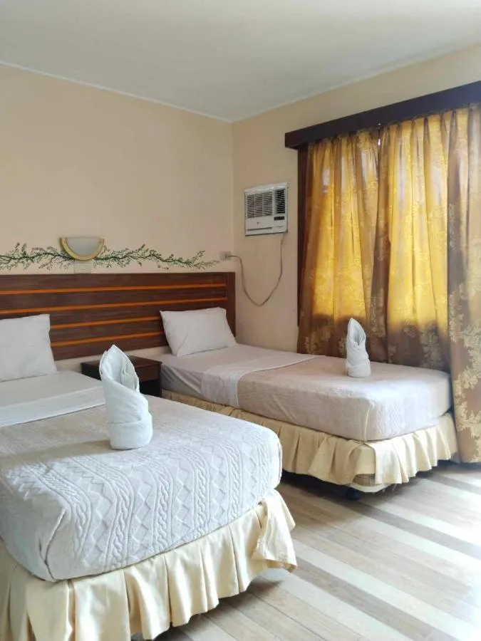 Bed in F and C Guesthouse by Hiverooms