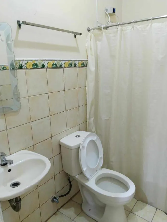 Shower in F and C Guesthouse by Hiverooms