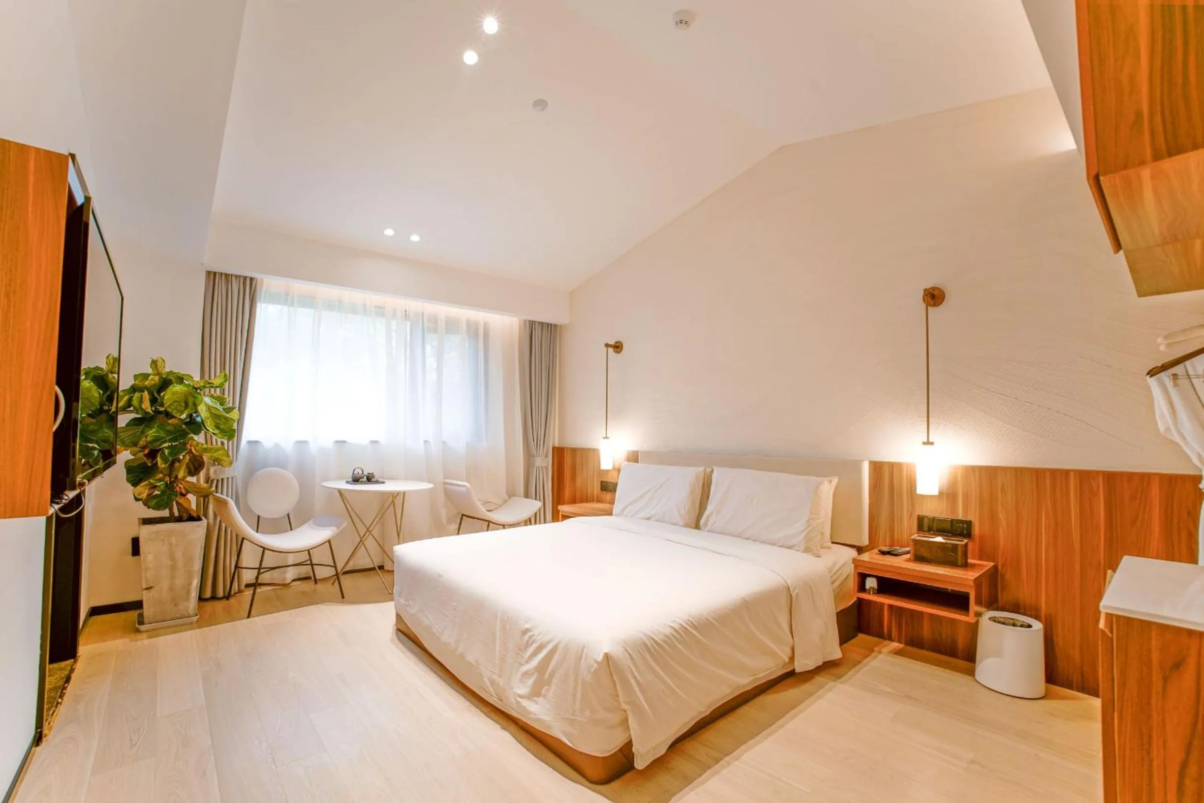 Seating area, Bed in Xishang Yunjian Holiday Hotel