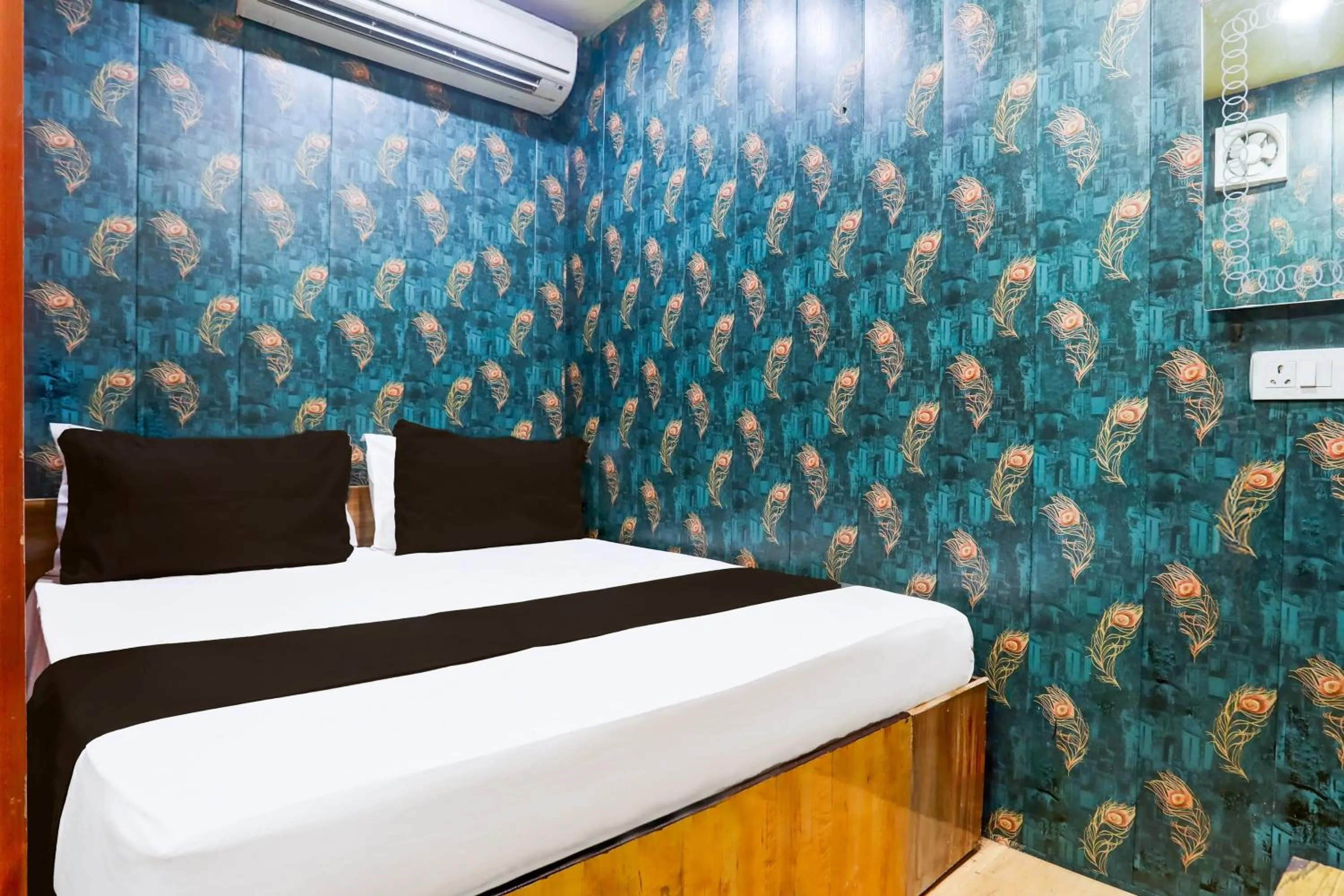 Bedroom in Hotel O A K Residency