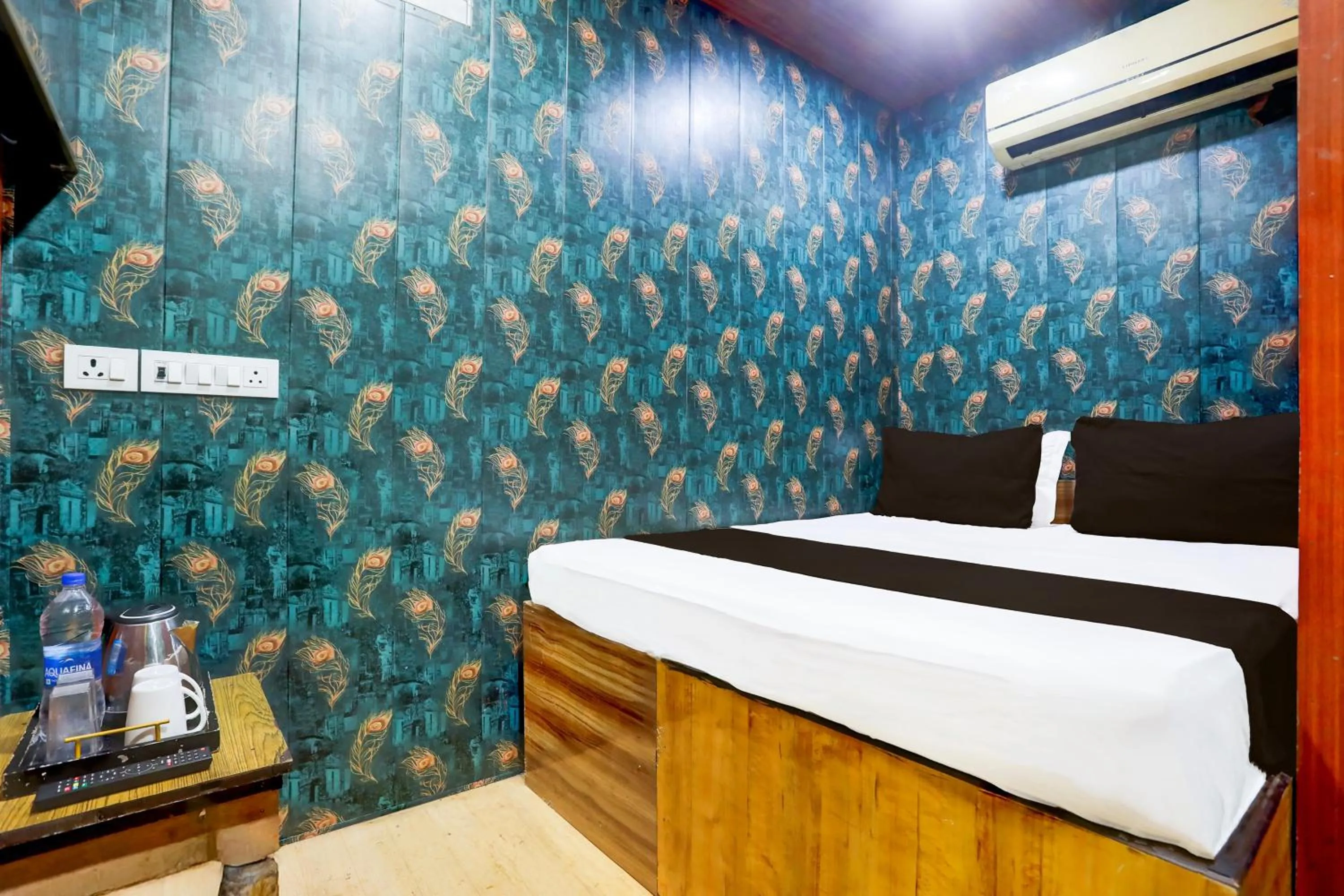 Bedroom in Hotel O A K Residency