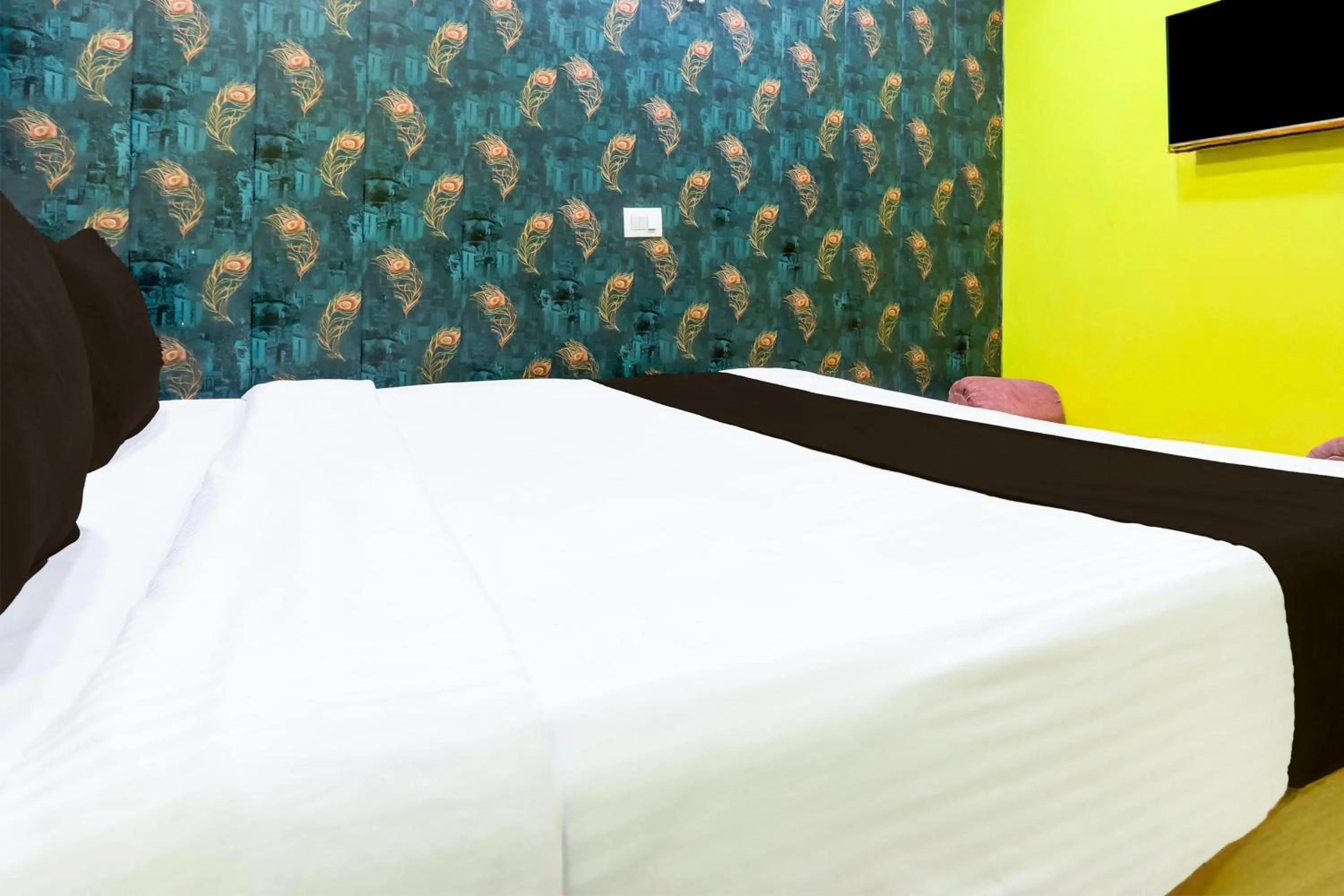 Bedroom in Hotel O A K Residency