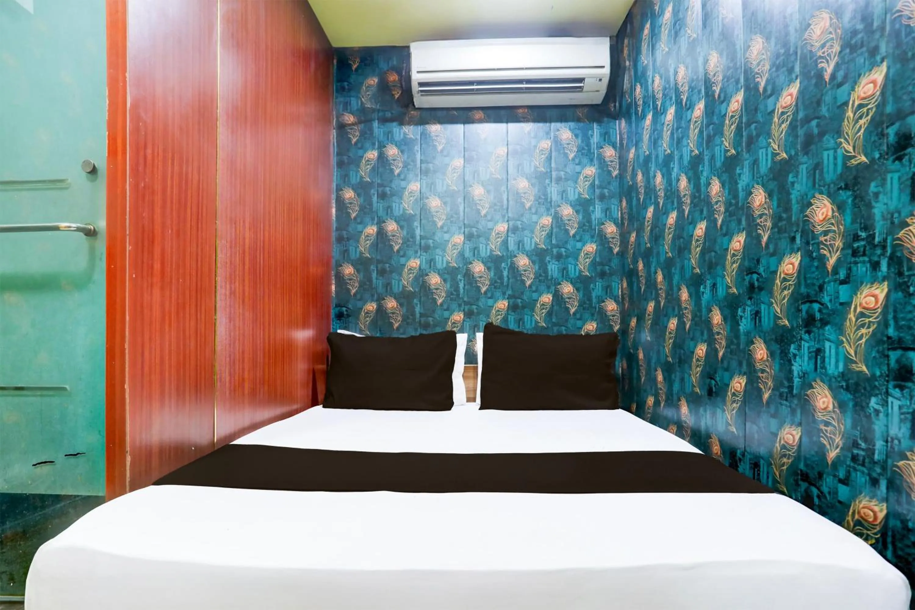 Bedroom in Hotel O A K Residency