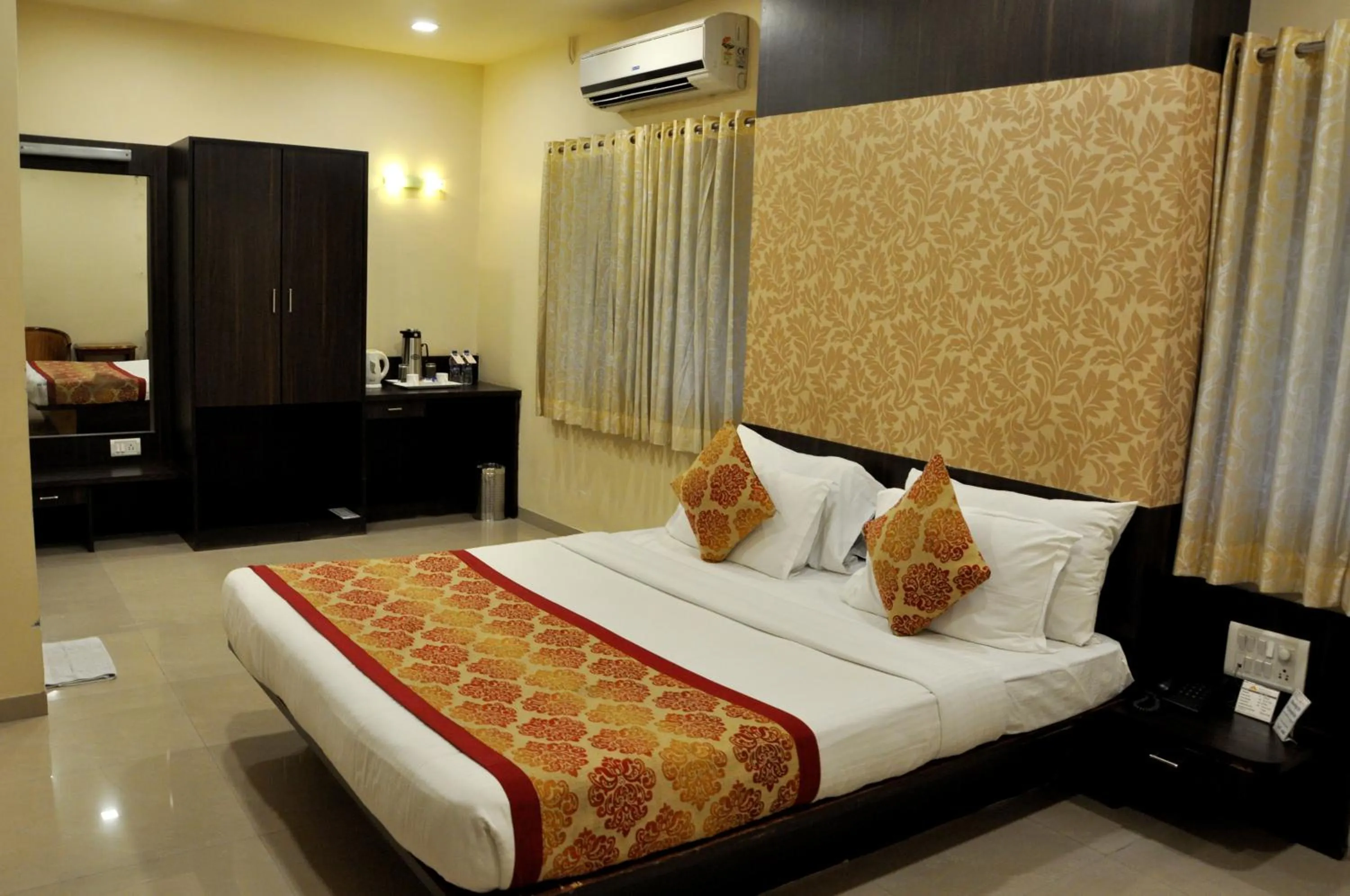 Photo of the whole room, Bed in Hotel Atria, Kolhapur