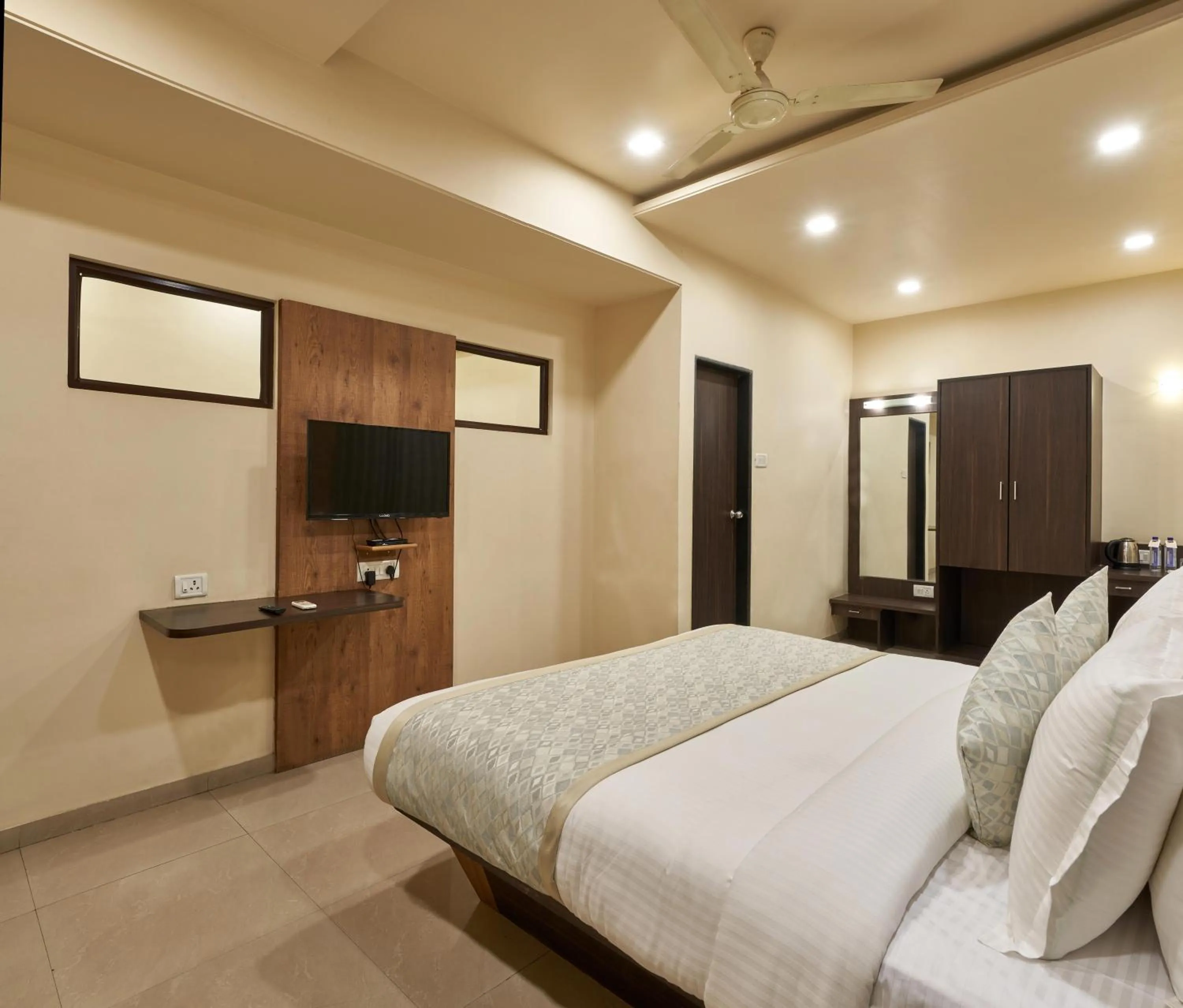 Photo of the whole room, Bed in Hotel Atria, Kolhapur