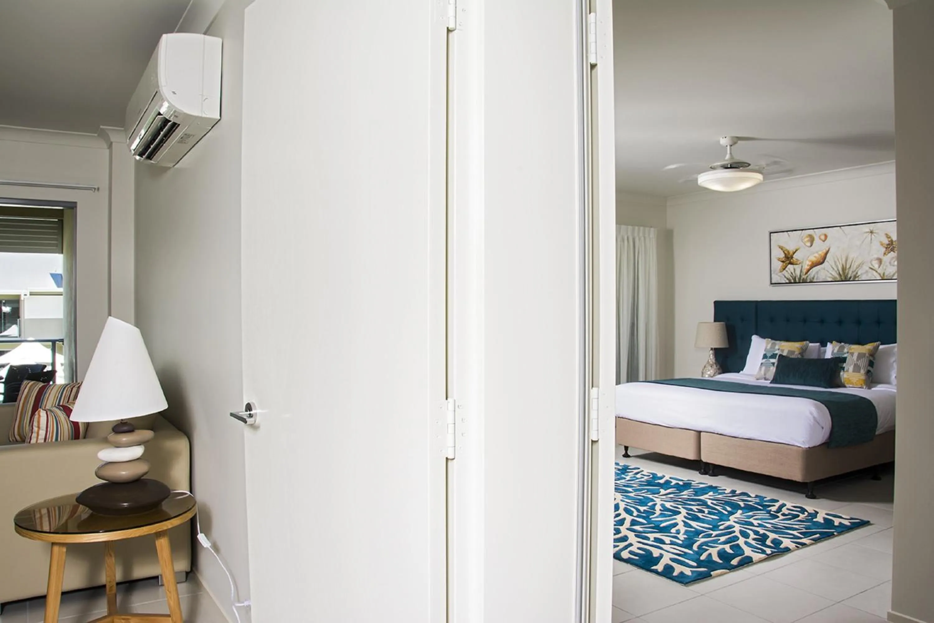 Living room, Bed in 1770 Lagoons Central Apartment Resort Official