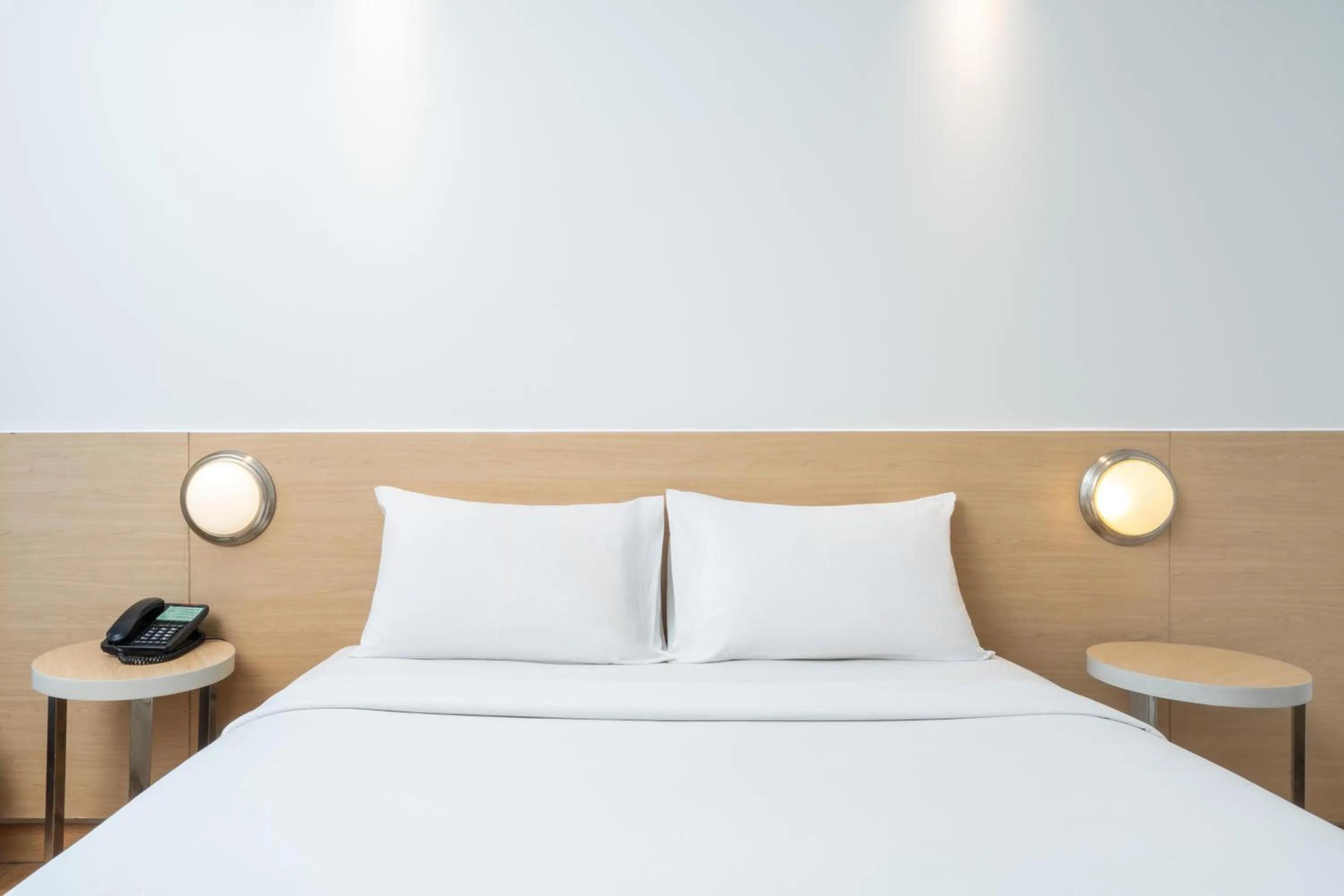 Bed in Indies Style Malioboro Hotel