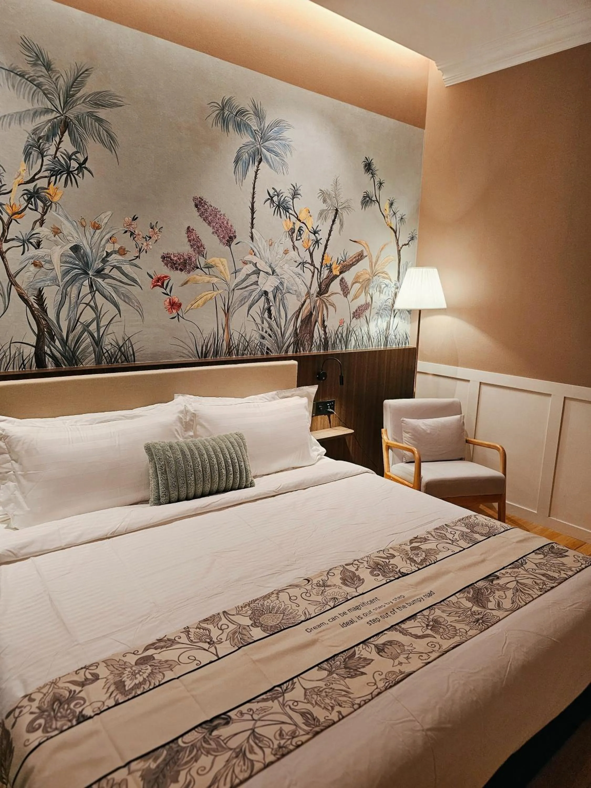 Bed in The Palm Suite at Lava Mansion