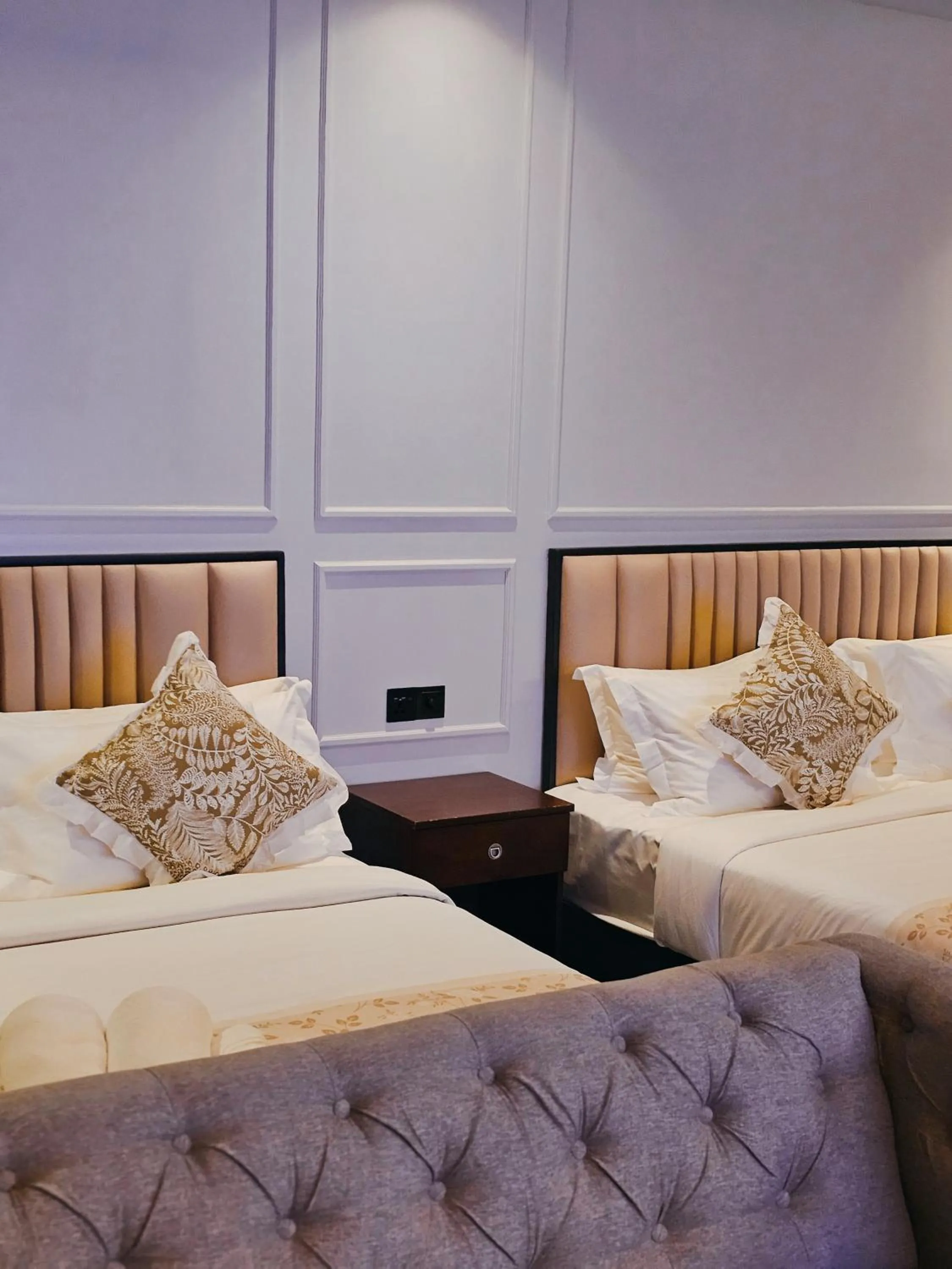 Bed in The Palm Suite at Lava Mansion