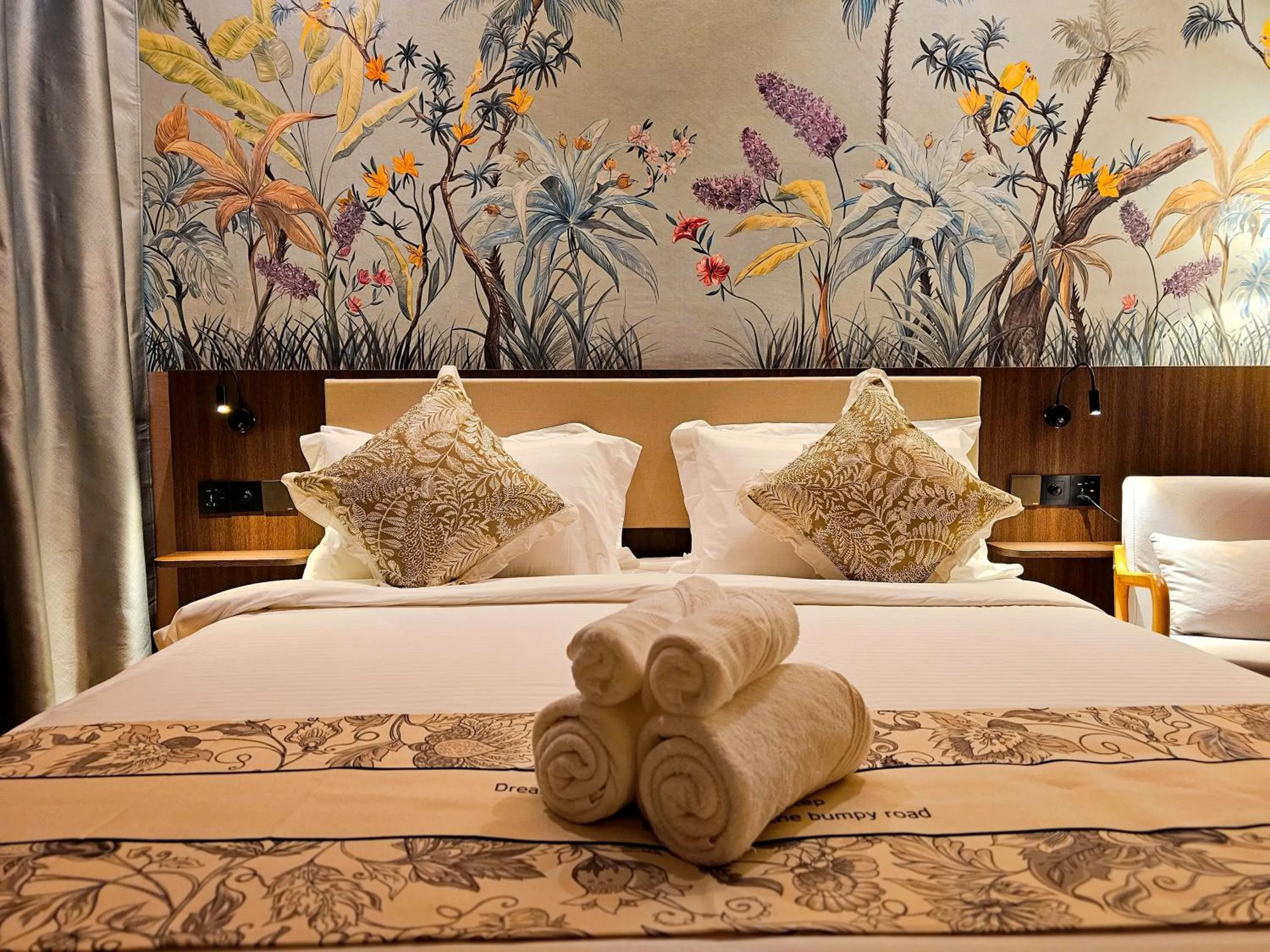 Bed in The Palm Suite at Lava Mansion