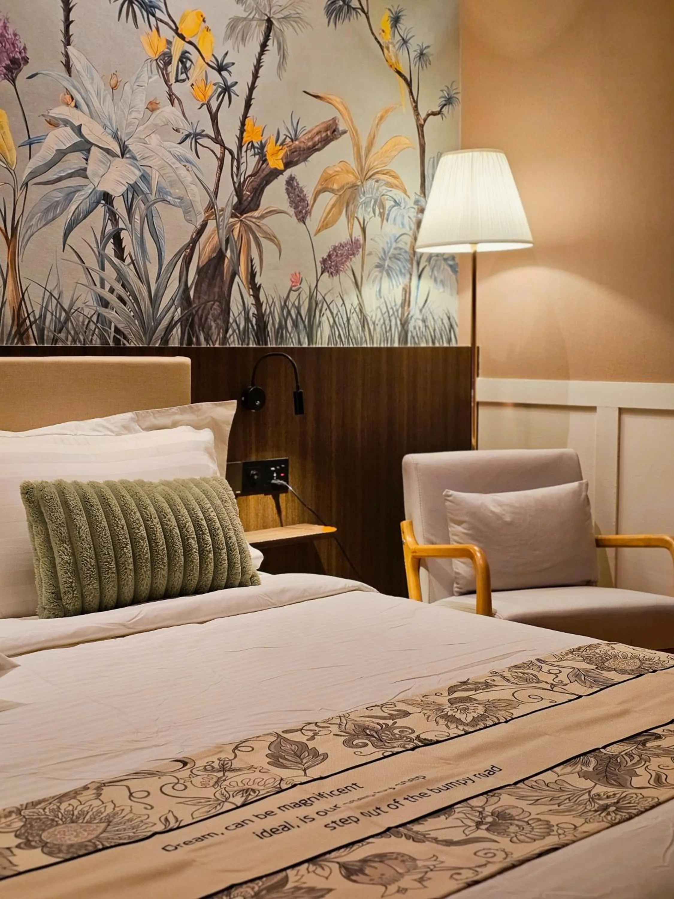 Bed in The Palm Suite at Lava Mansion