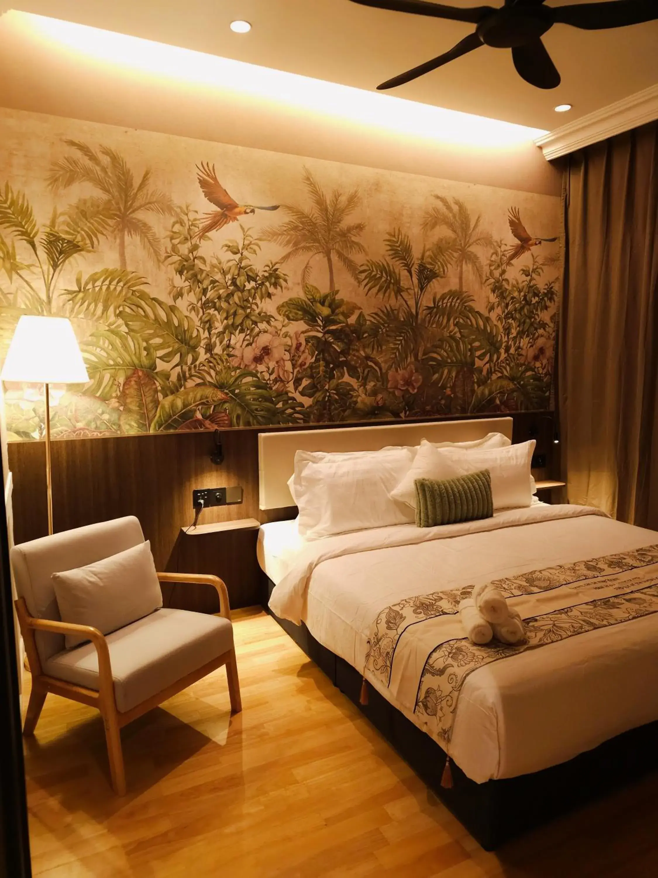 Bed in The Palm Suite at Lava Mansion Bed in The Palm Suite at Lava Mansion