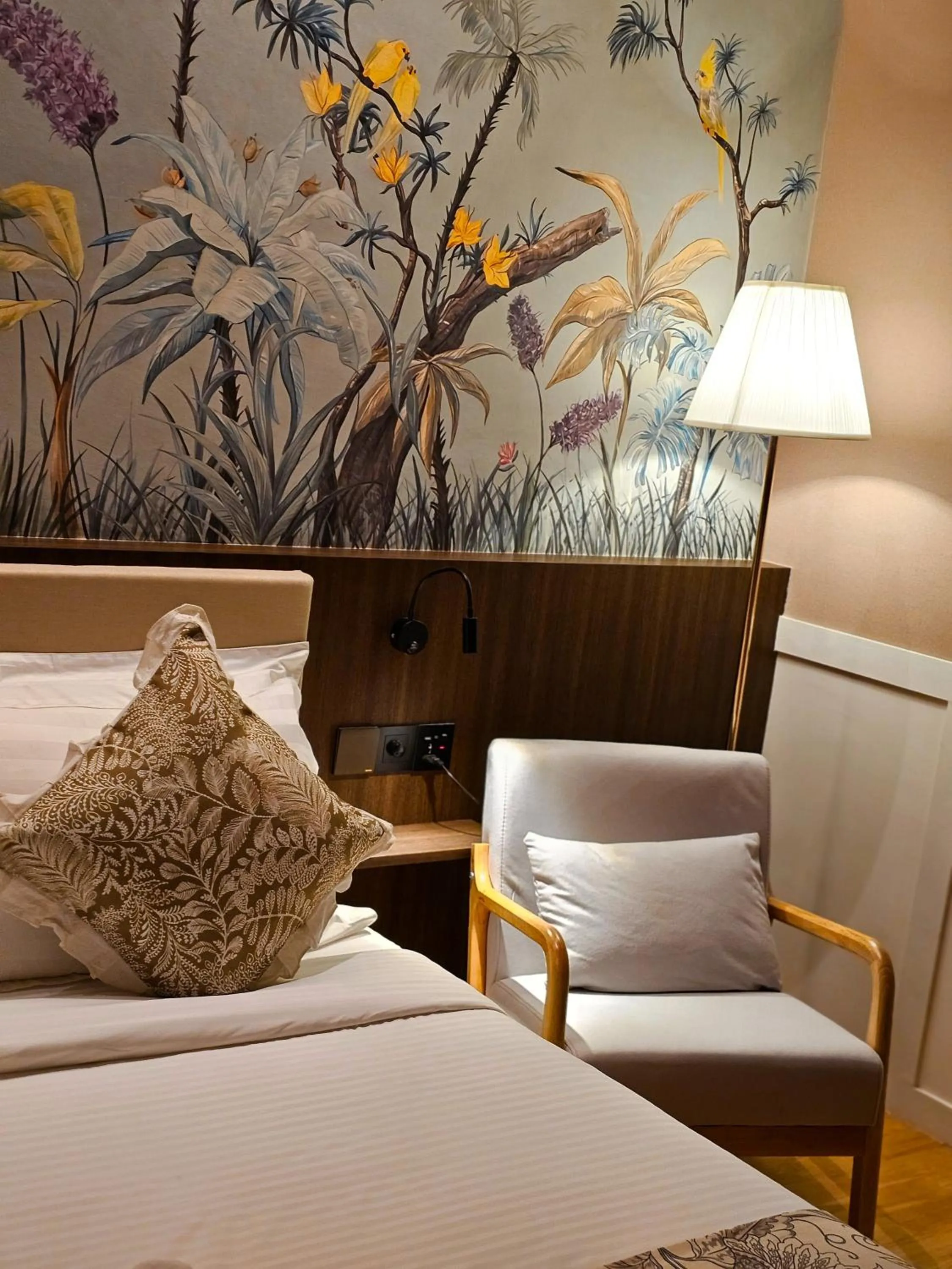 Bed in The Palm Suite at Lava Mansion