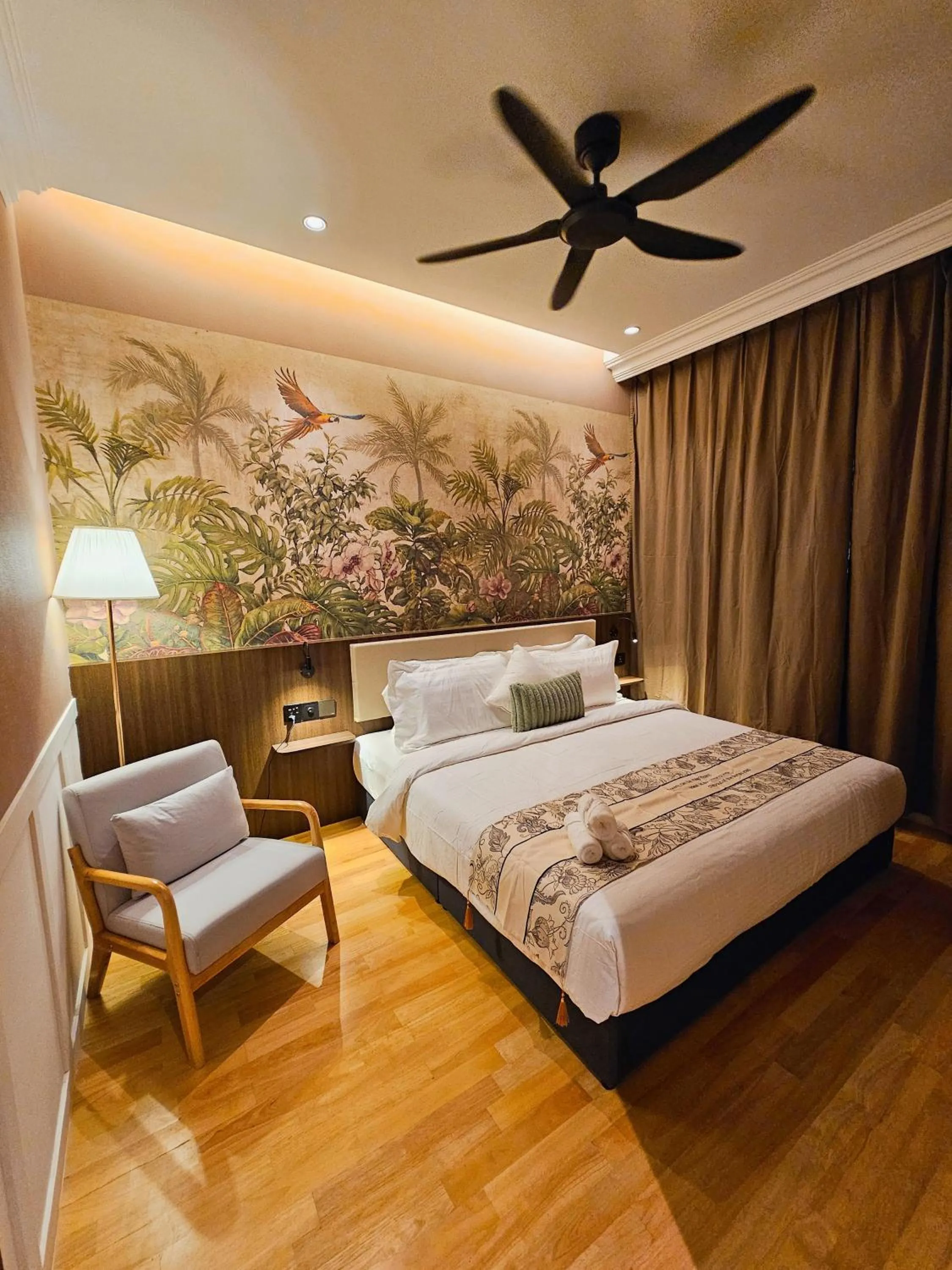 Bed in The Palm Suite at Lava Mansion