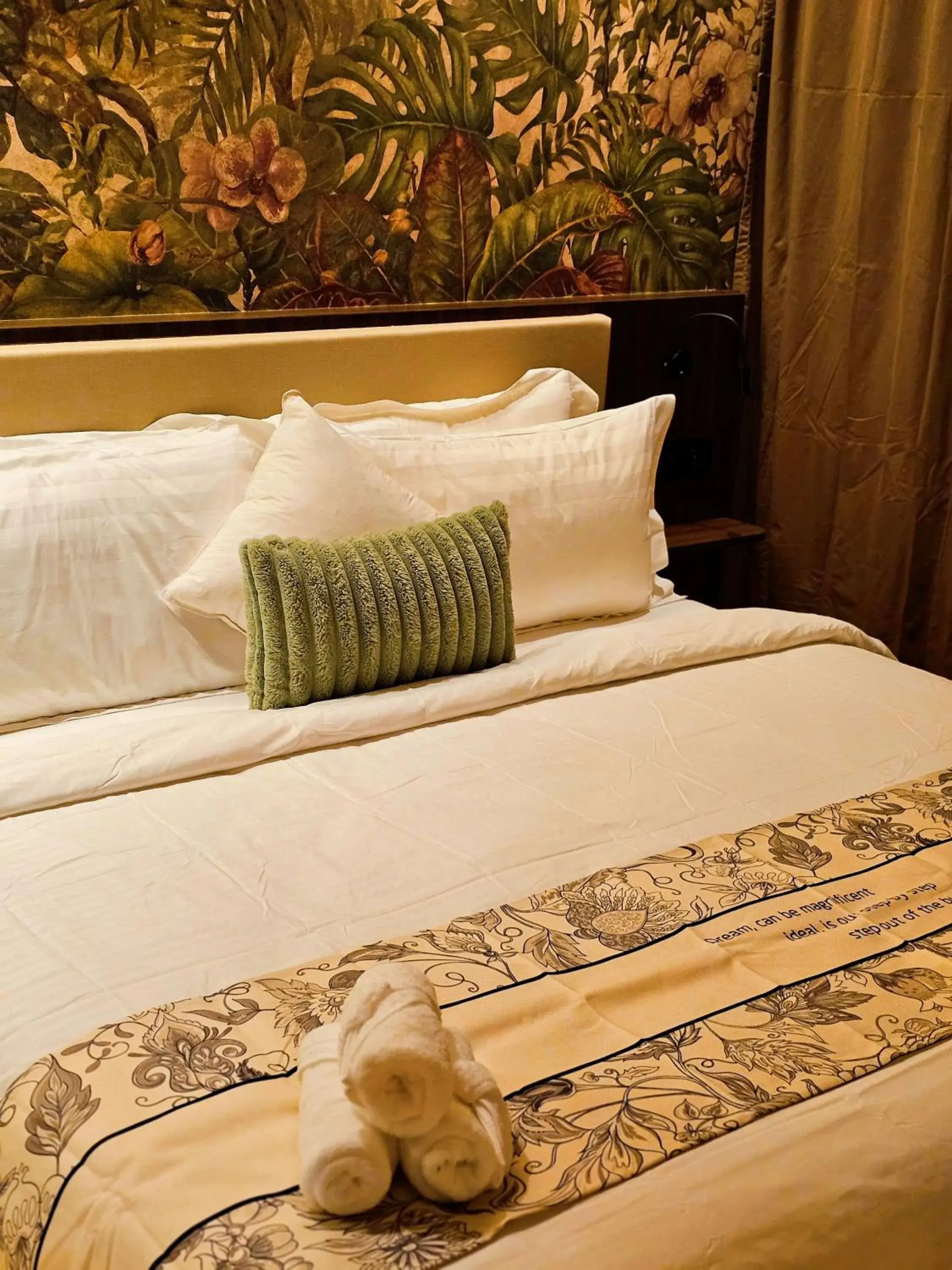 Bed in The Palm Suite at Lava Mansion Bed in The Palm Suite at Lava Mansion