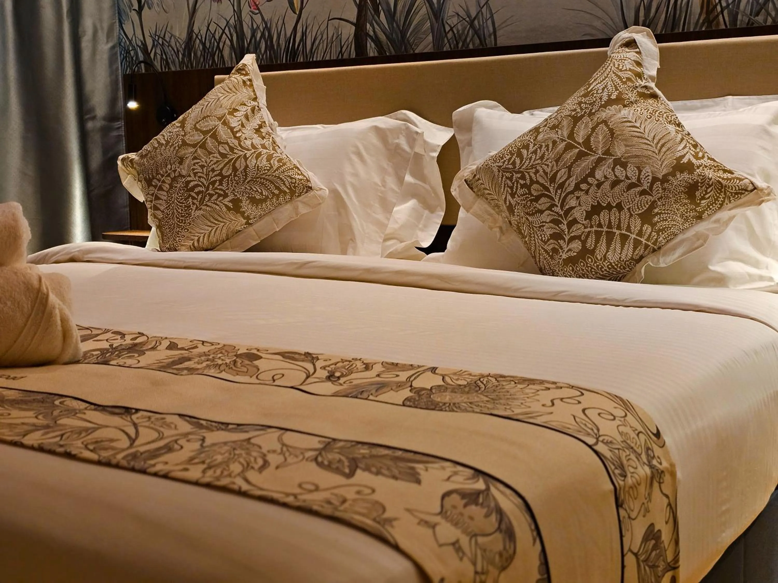 Bed in The Palm Suite at Lava Mansion