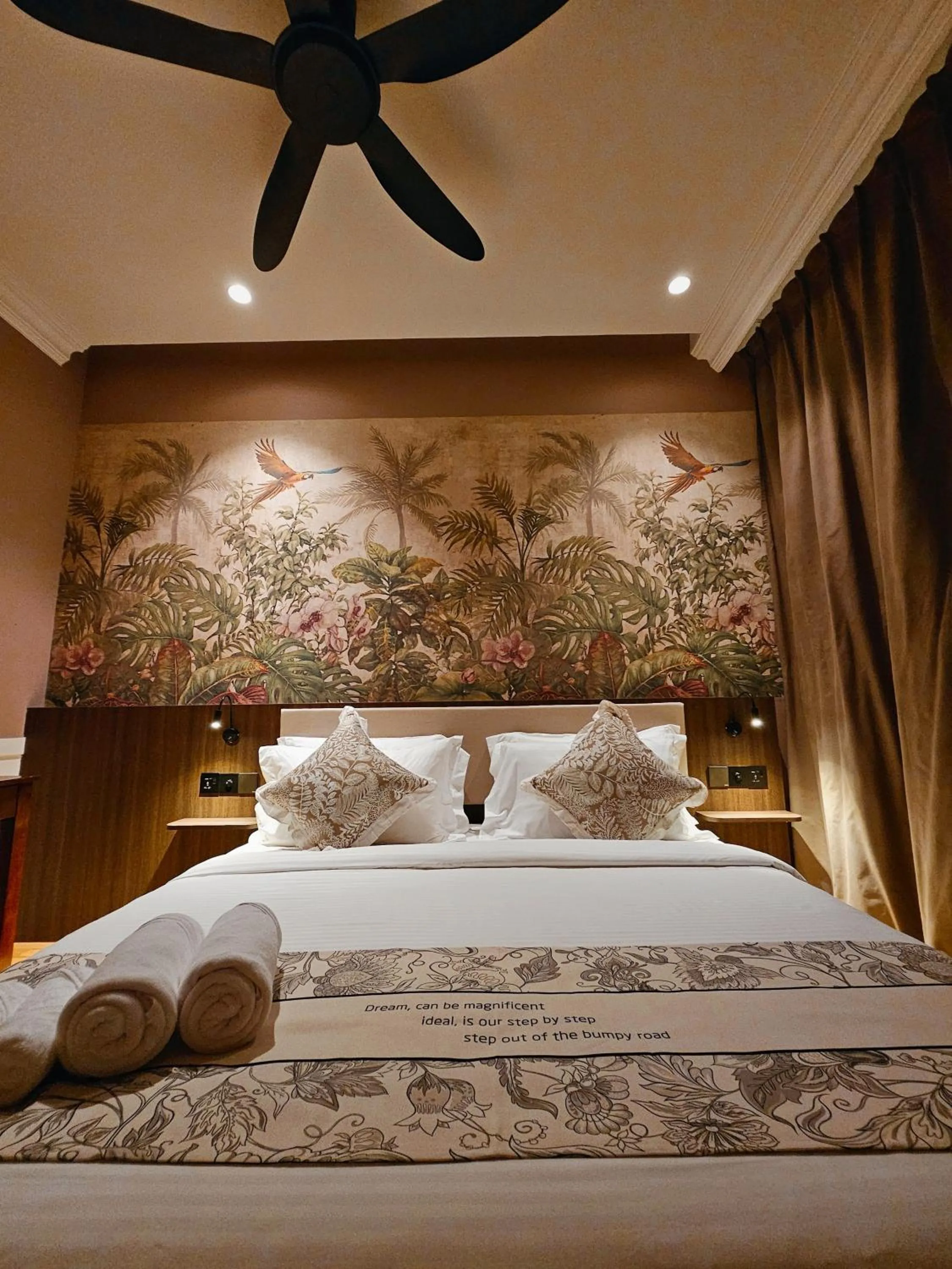 Bed in The Palm Suite at Lava Mansion