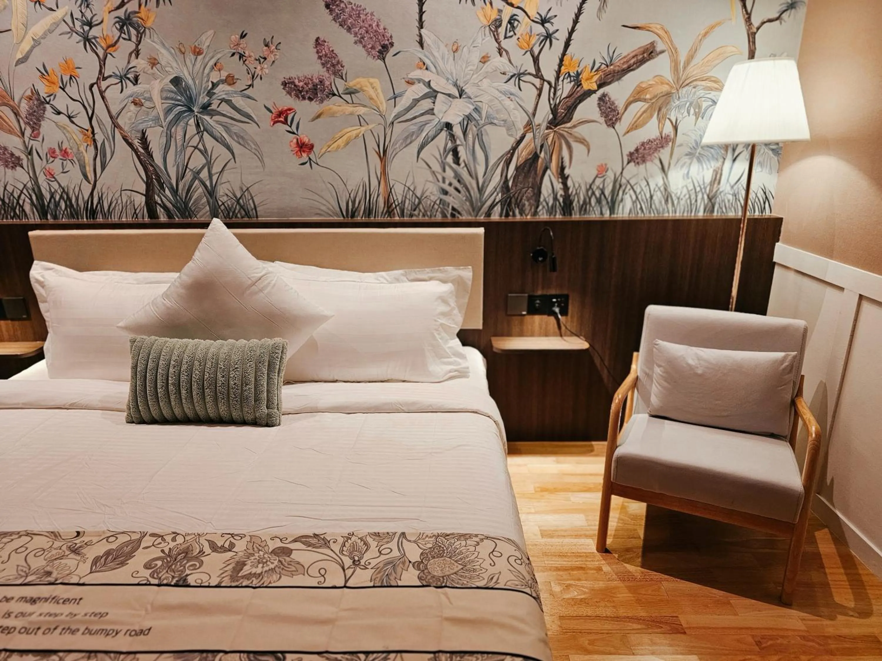 Bed in The Palm Suite at Lava Mansion