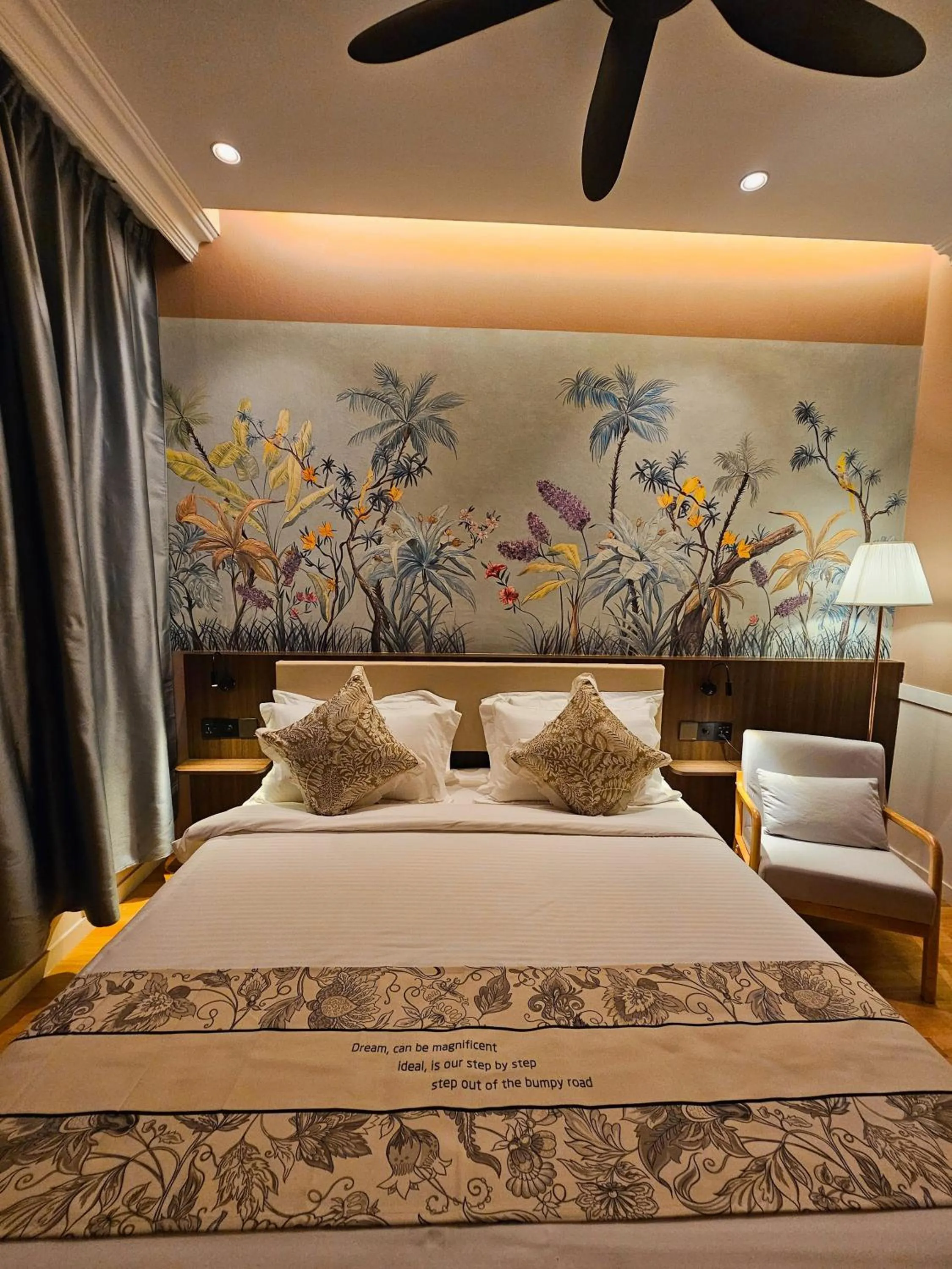 Bed in The Palm Suite at Lava Mansion