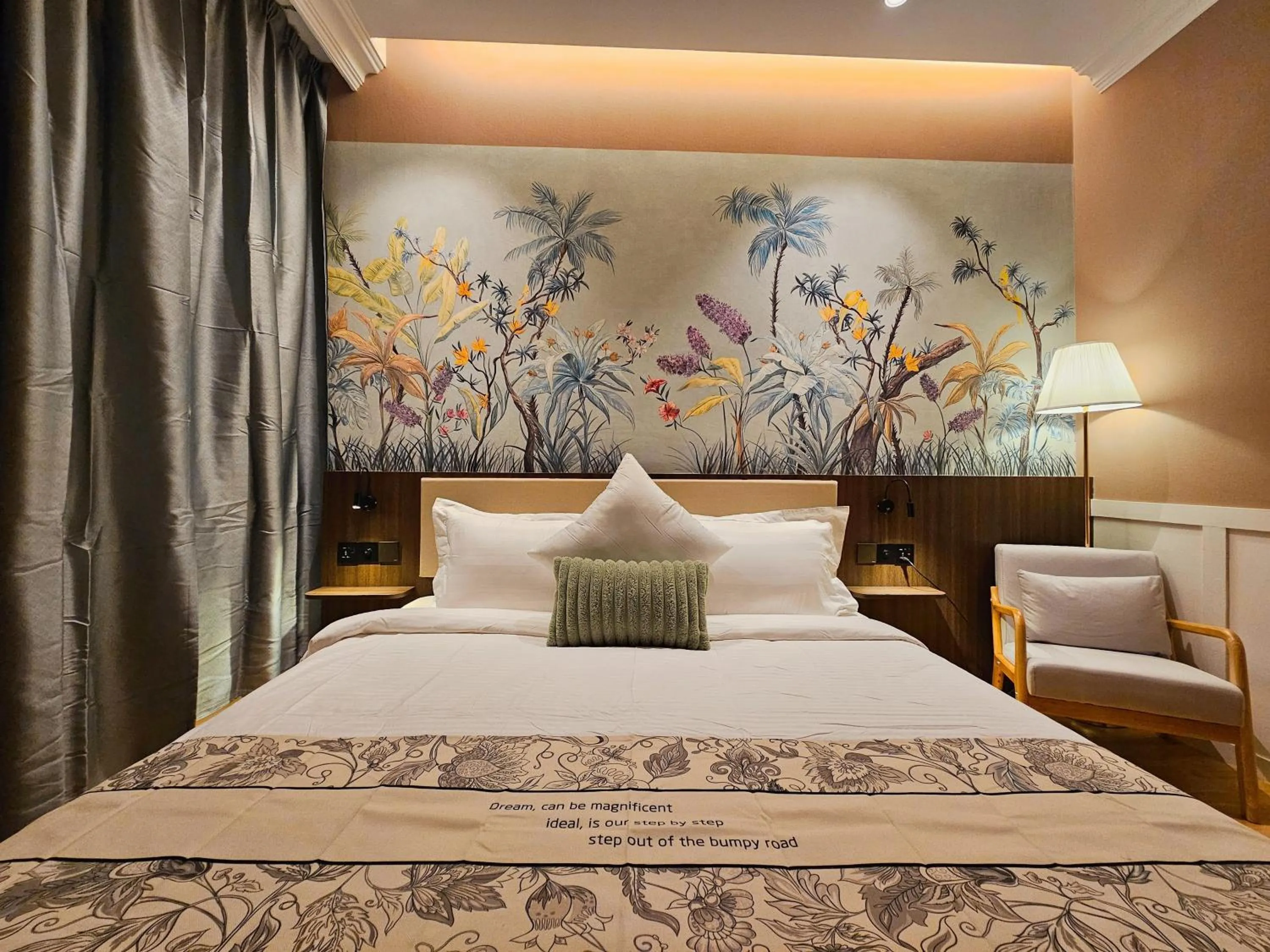 Bed in The Palm Suite at Lava Mansion