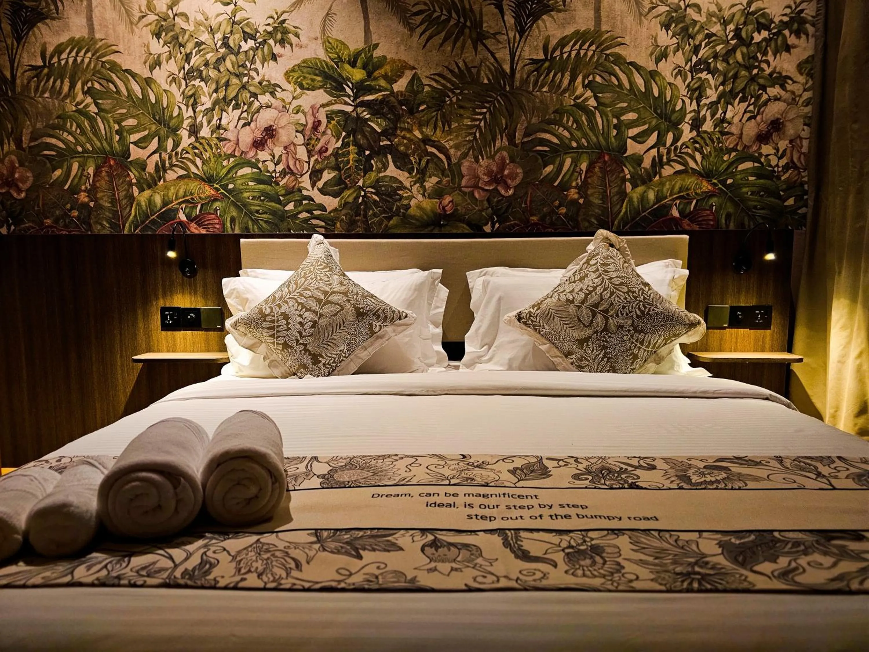 Bed in The Palm Suite at Lava Mansion