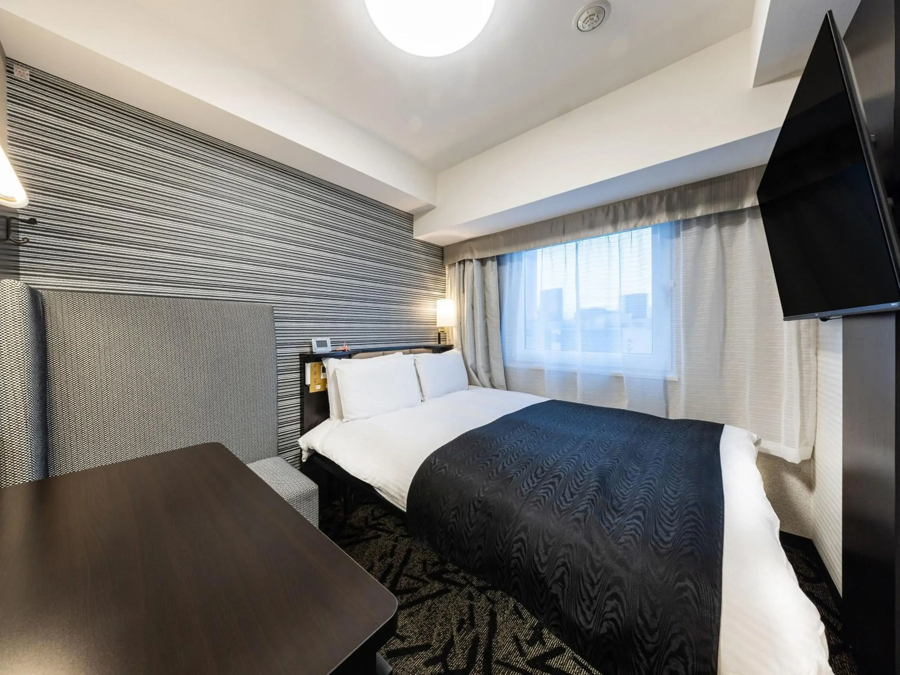 Photo of the whole room, Bed in APA Hotel Akabane Iwabuchi Ekimae Photo of the whole room, Bed in APA Hotel Akabane Iwabuchi Ekimae