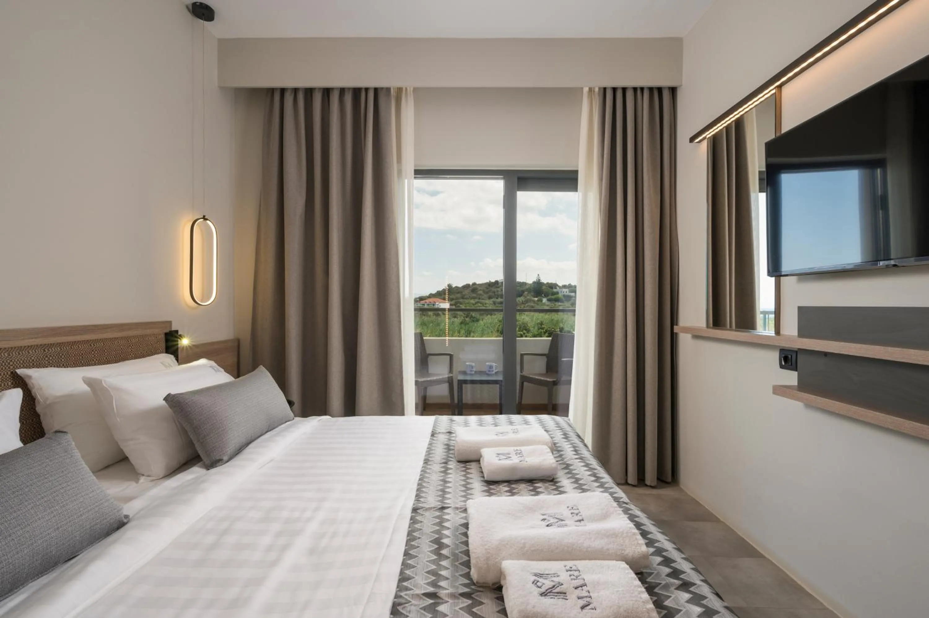 Bed in Mare Village Hotel