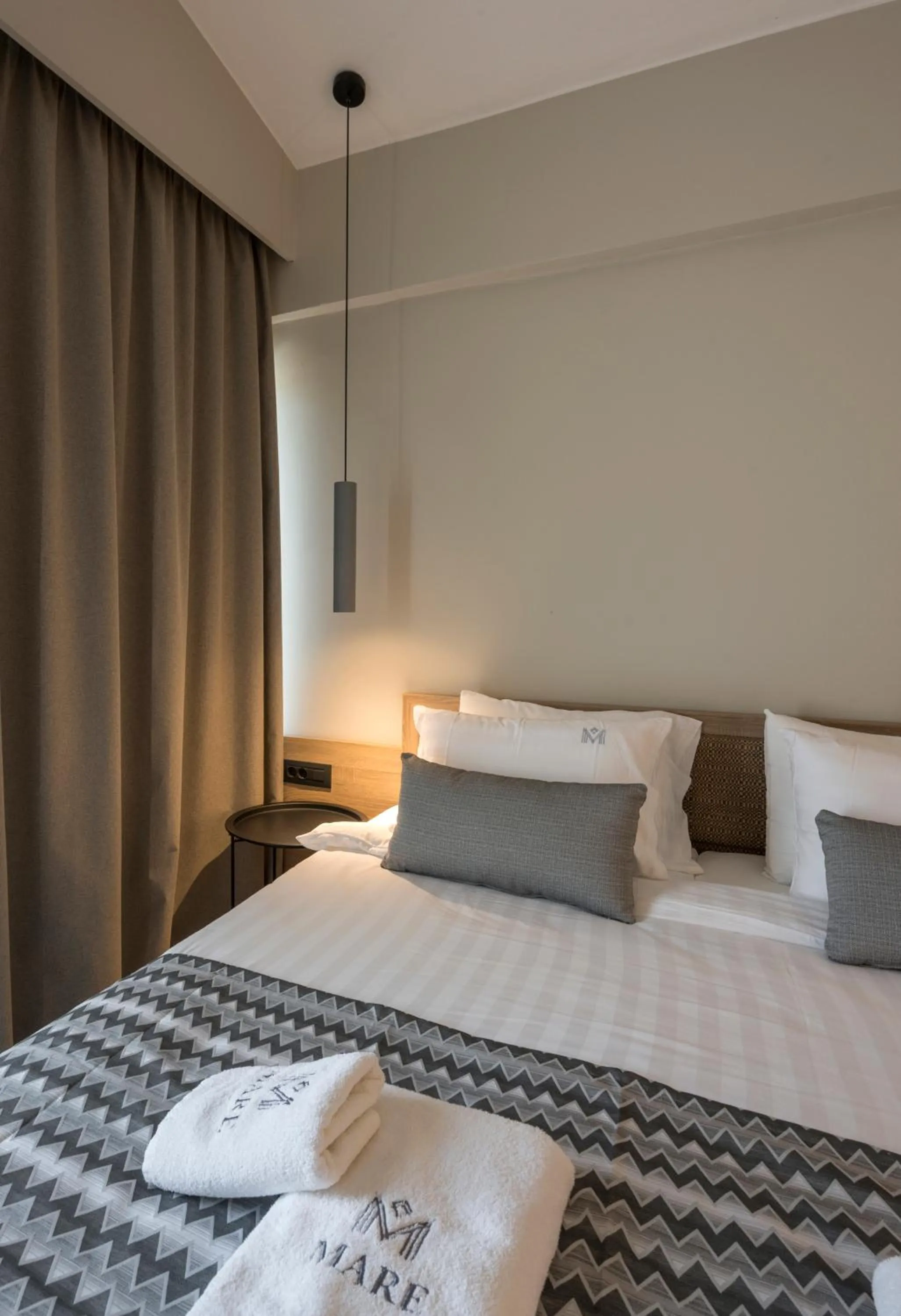 Bed in Mare Village Hotel