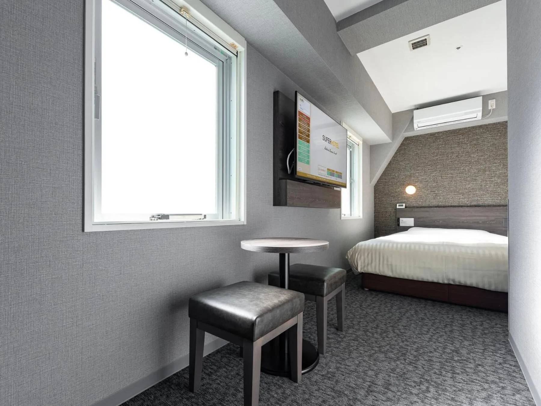 Bed in SUPER HOTEL Ikebukuro West Natural Hot Spring