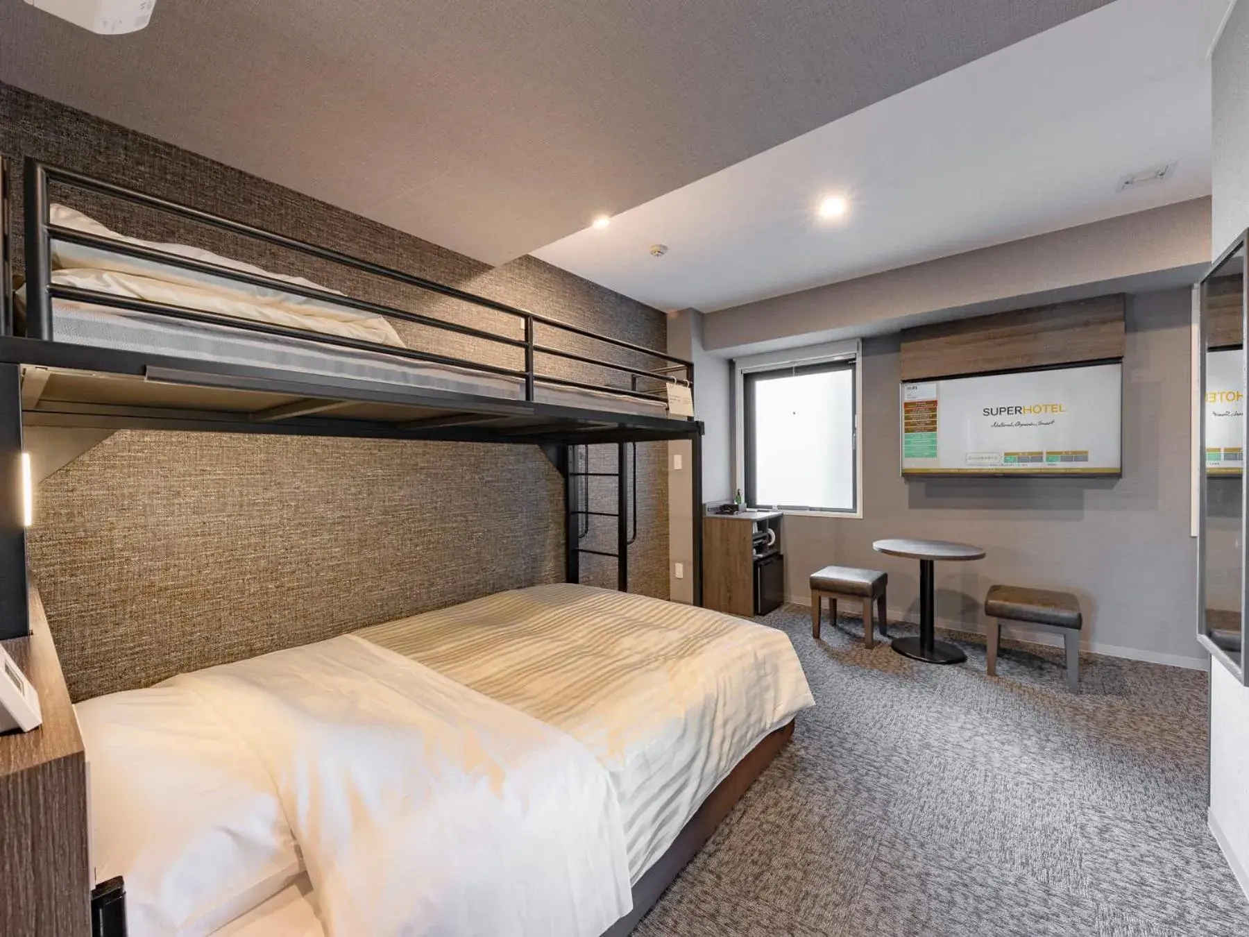 Bed in SUPER HOTEL Ikebukuro West Natural Hot Spring Bed in SUPER HOTEL Ikebukuro West Natural Hot Spring